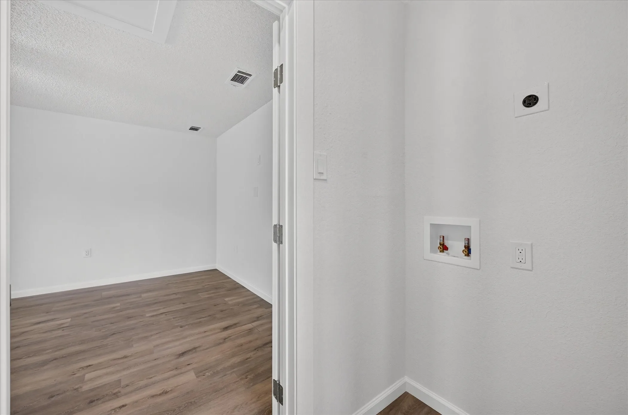 Laundry room positioned between the dinning room and bonus room, wired for either a stacked W/D setup or separate!