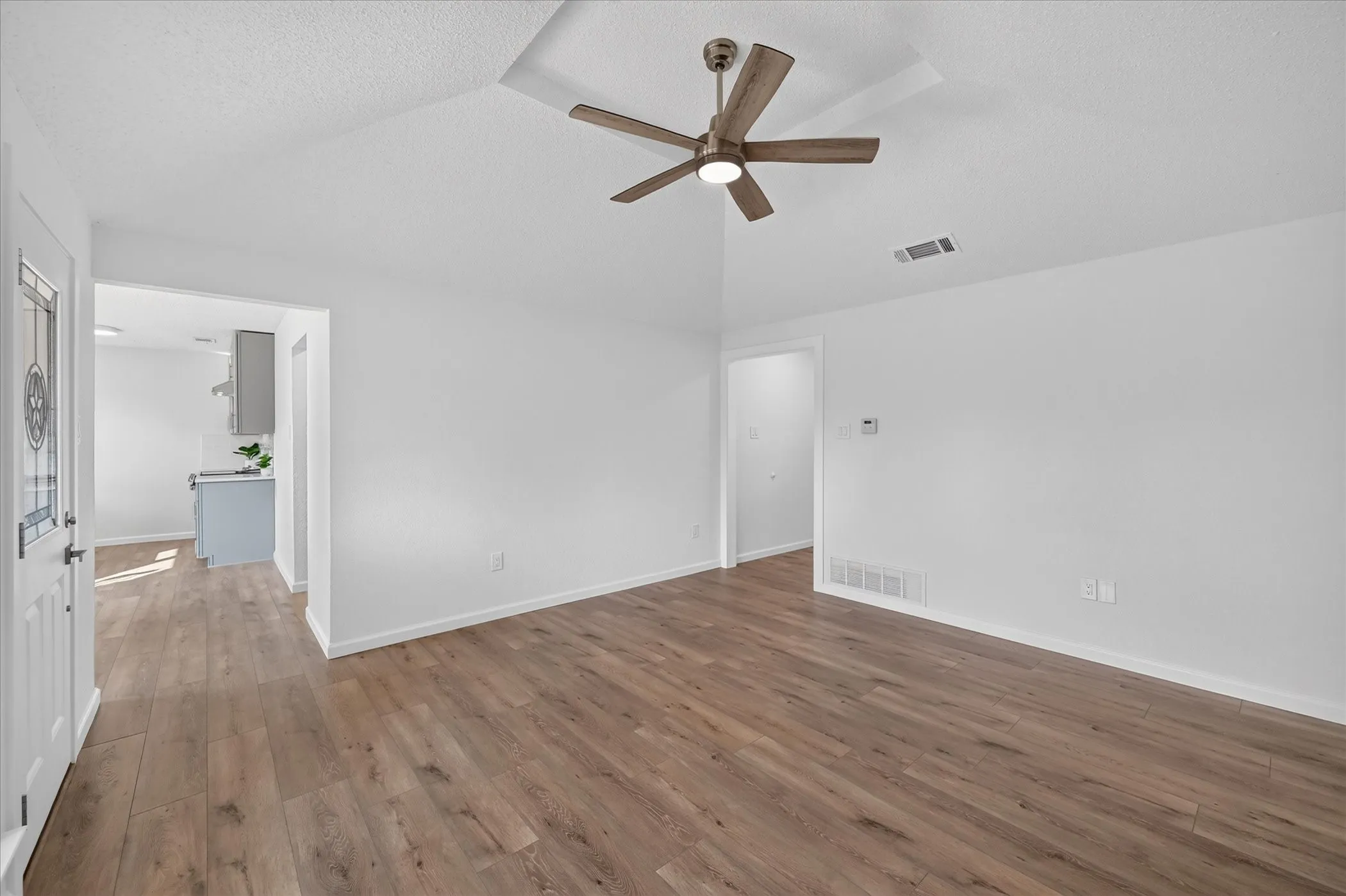View looking at the entry way, to the left is the dining, kitchen, laundry and bonus room!