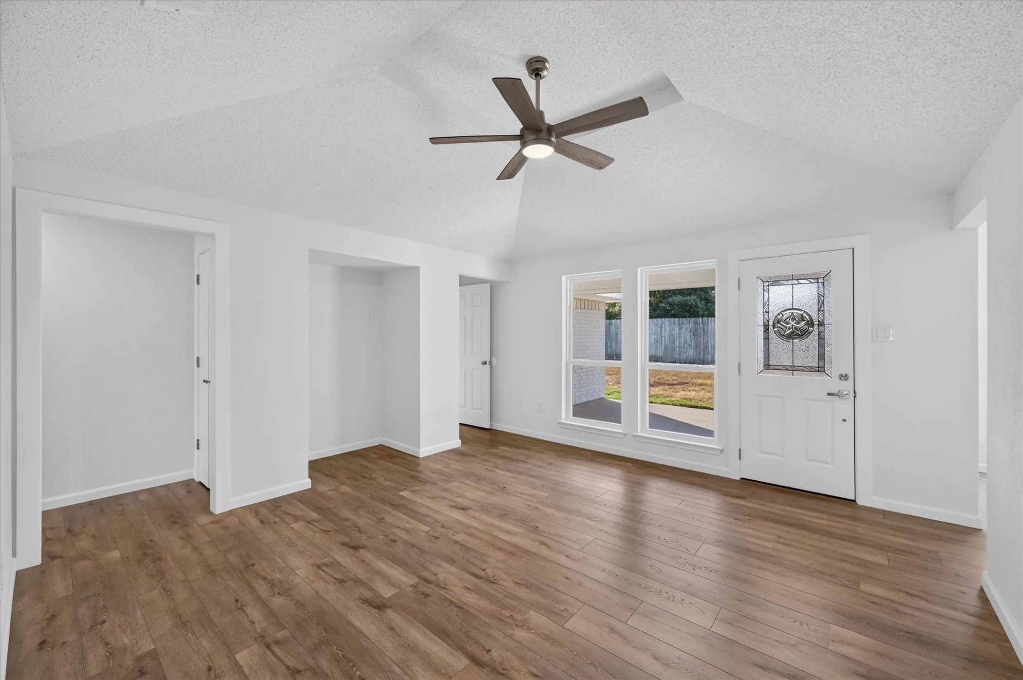 Upon entering the front door you are greeting with a vaulted ceiling living room!
