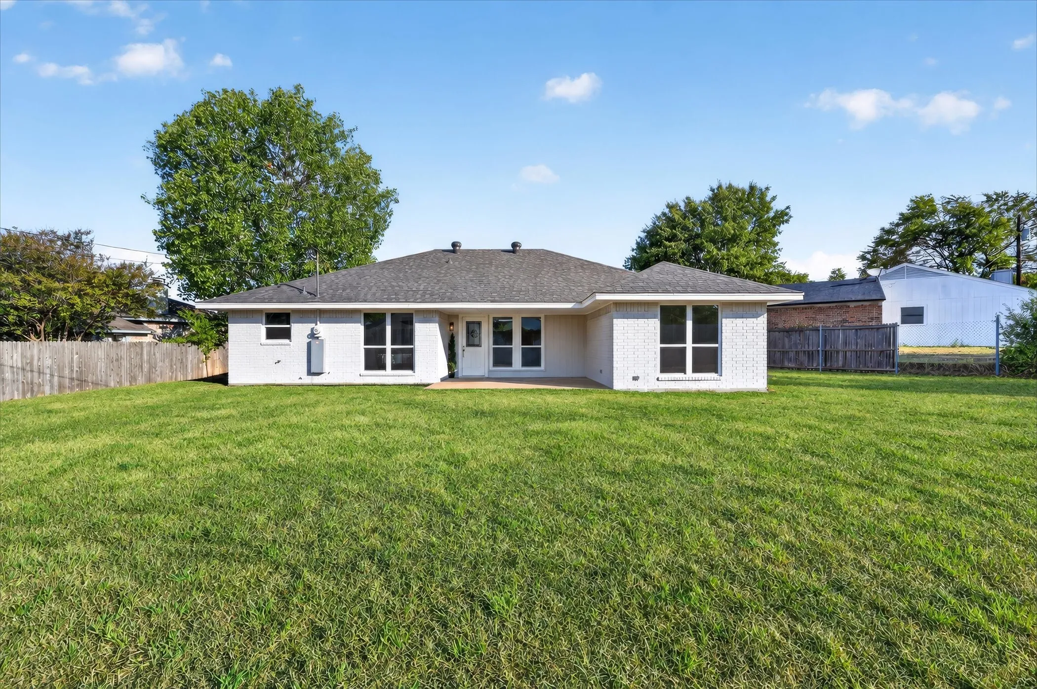 Huge backyard with so much room for activities! Grass is digitally enhanced.