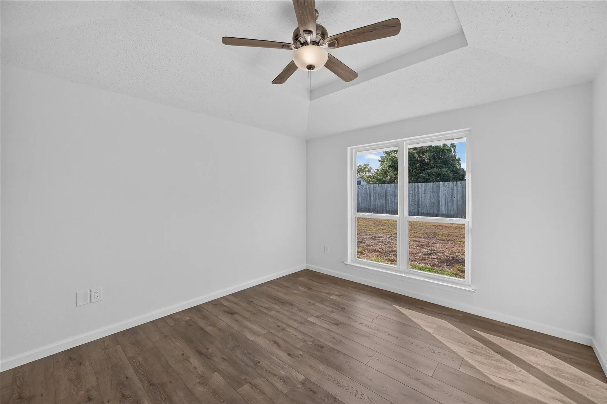 View from entry door of primary bedroom with great natural light!