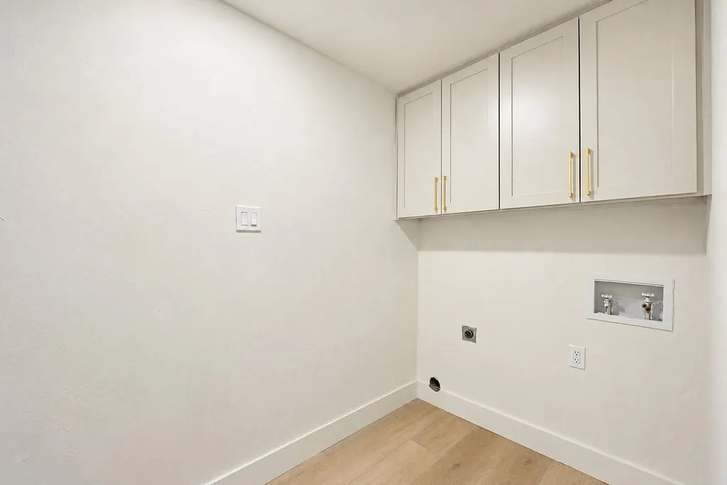 Upper cabinetry with gold-tone hardware