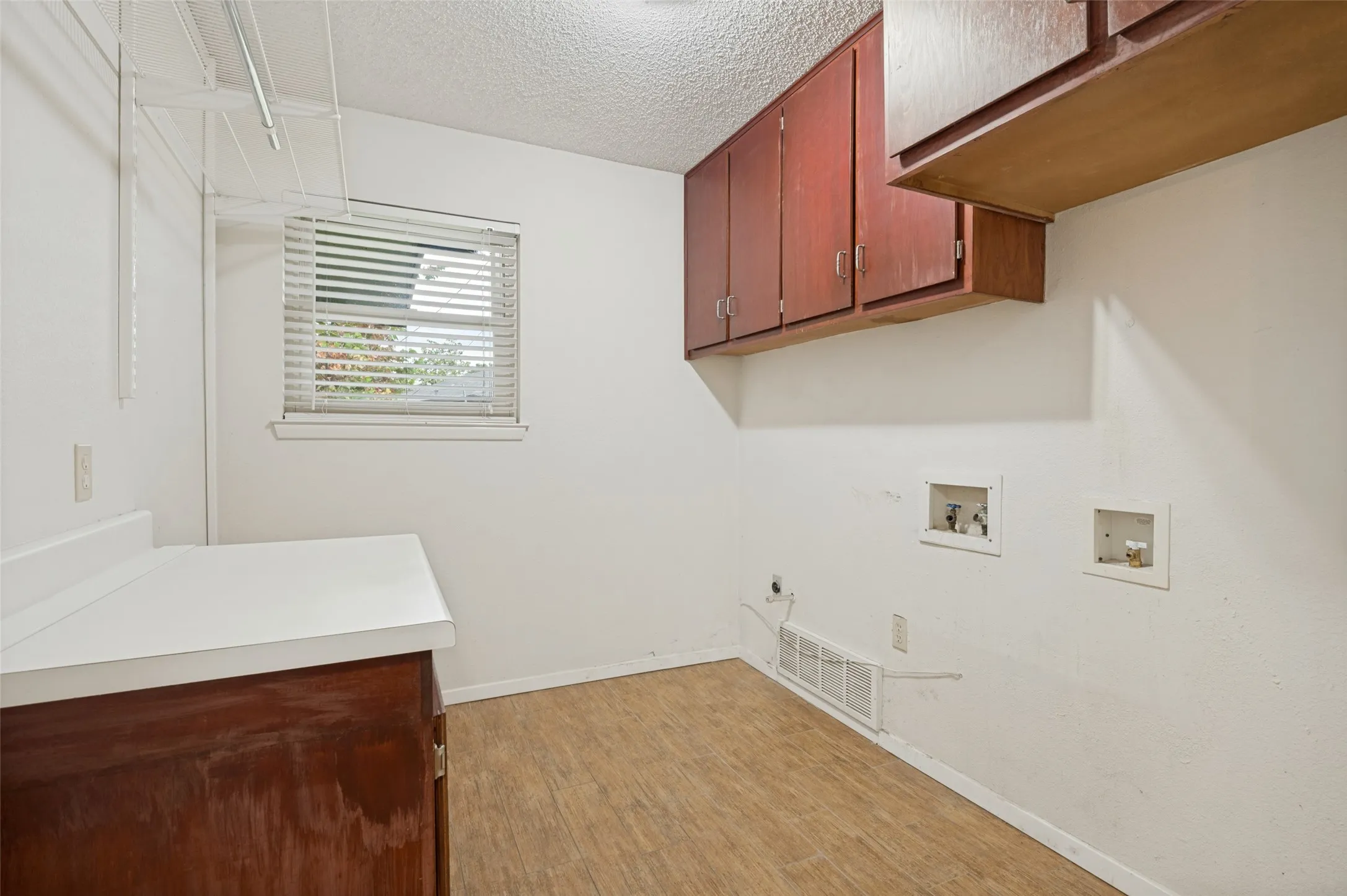 Oversized laundry room with spot for second fridge