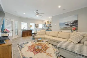 Recessed lighting, crown molding, wood-finish flooring, ceiling fan, and white trim