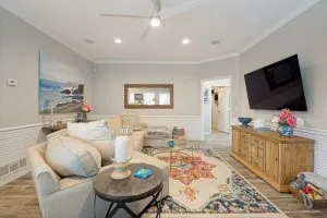Wood-finish flooring with crown molding and wainscoting