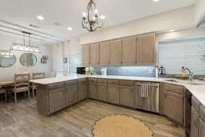 Kitchen featuring wood-finish flooring, recessed lighting, and a chandelier