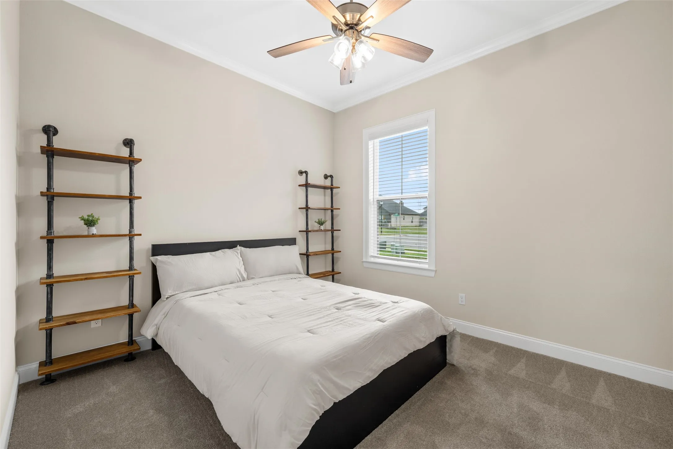 Recessed lighting, wood-finish ceiling fan with integrated lighting, window with blinds, carpeted flooring, and crown molding