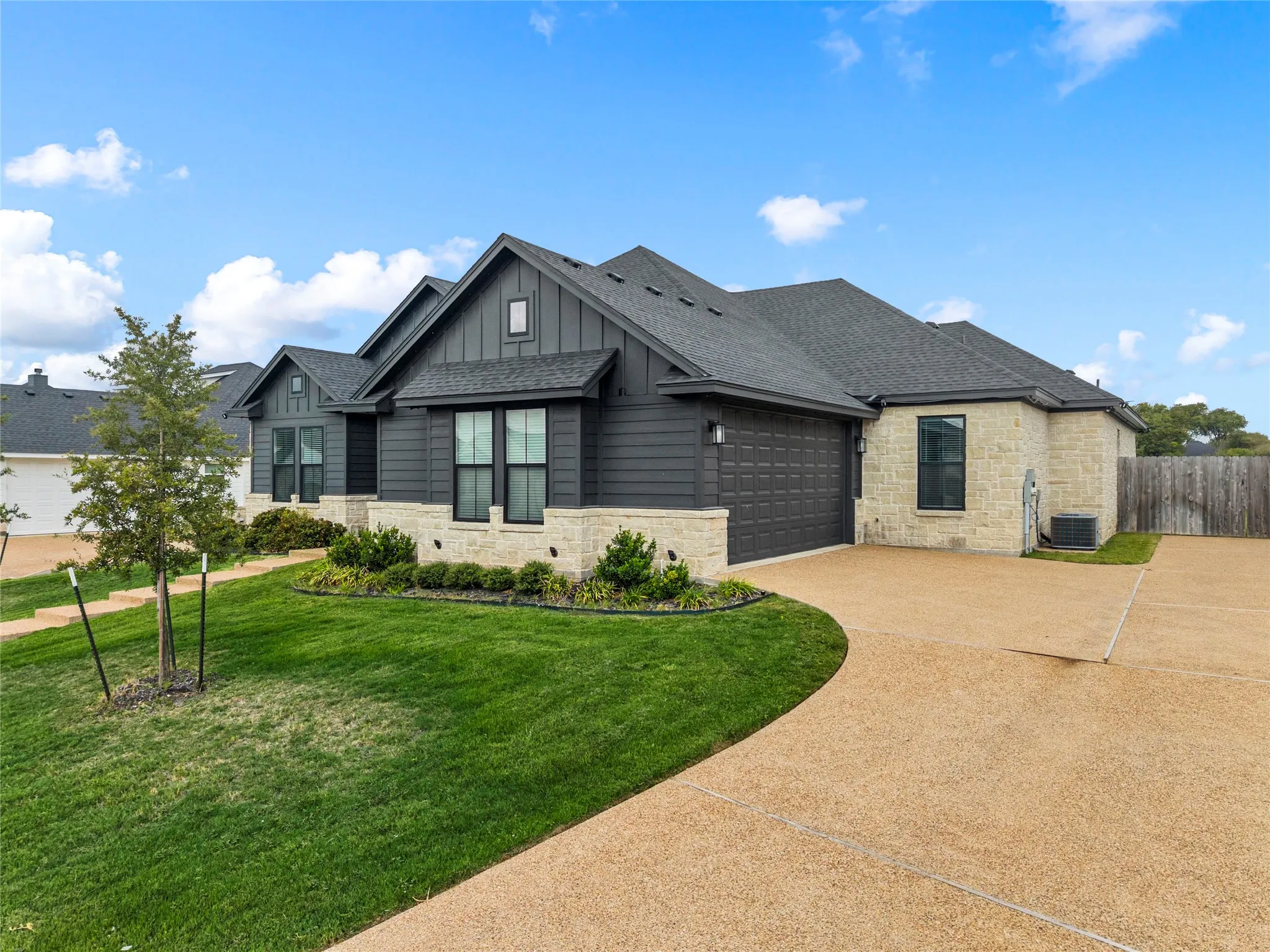 Contemporary exterior featuring stone and horizontal siding