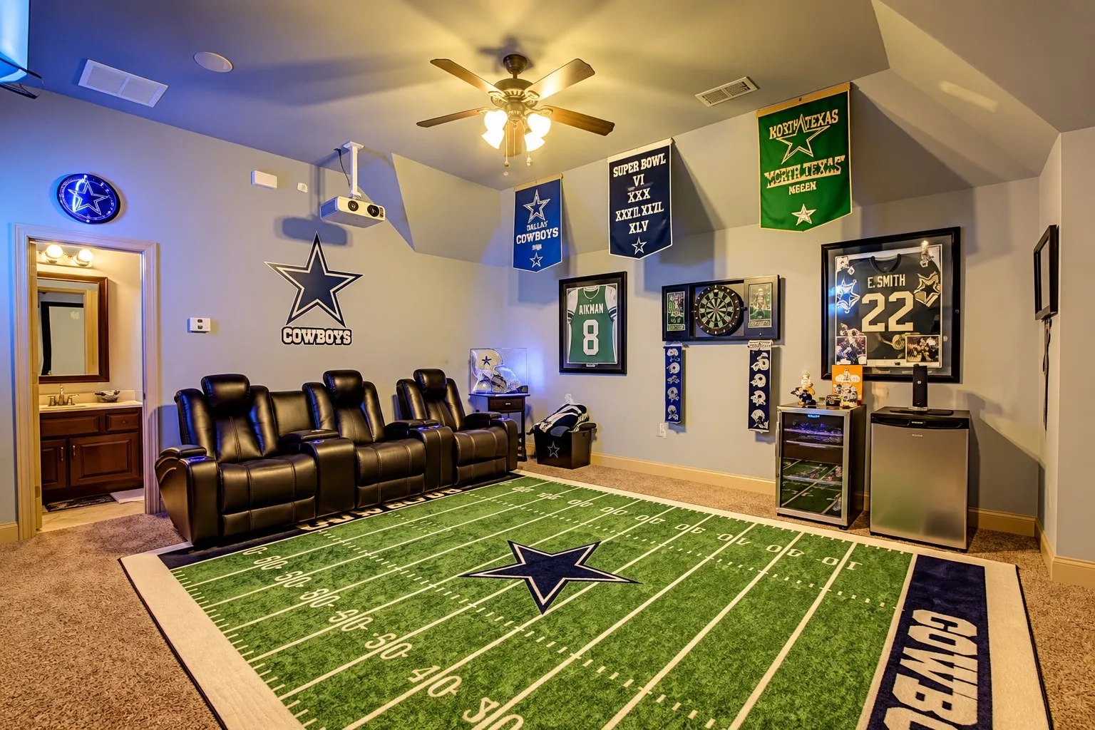 Tray ceiling with a ceiling fan, recessed lighting, and projector