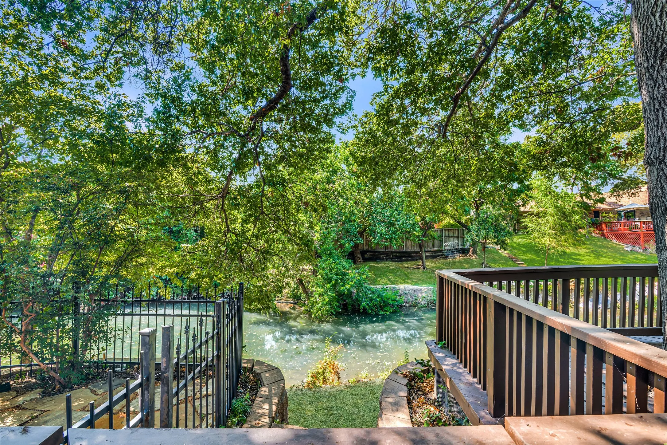 Access the creek from deck and patio, and the views continue!