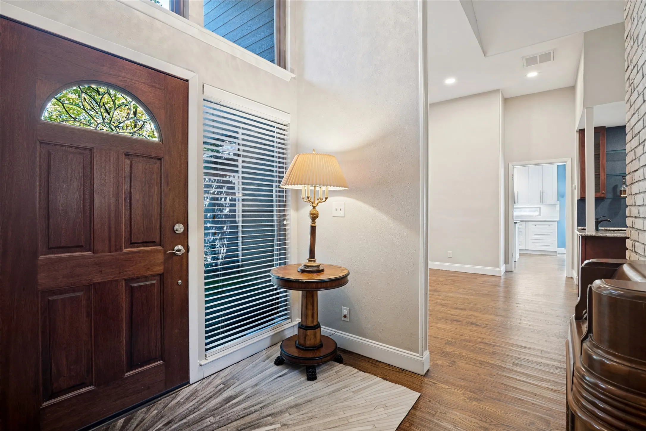 Enter into an architecturally significant home with high ceilings and handsome wood floors.