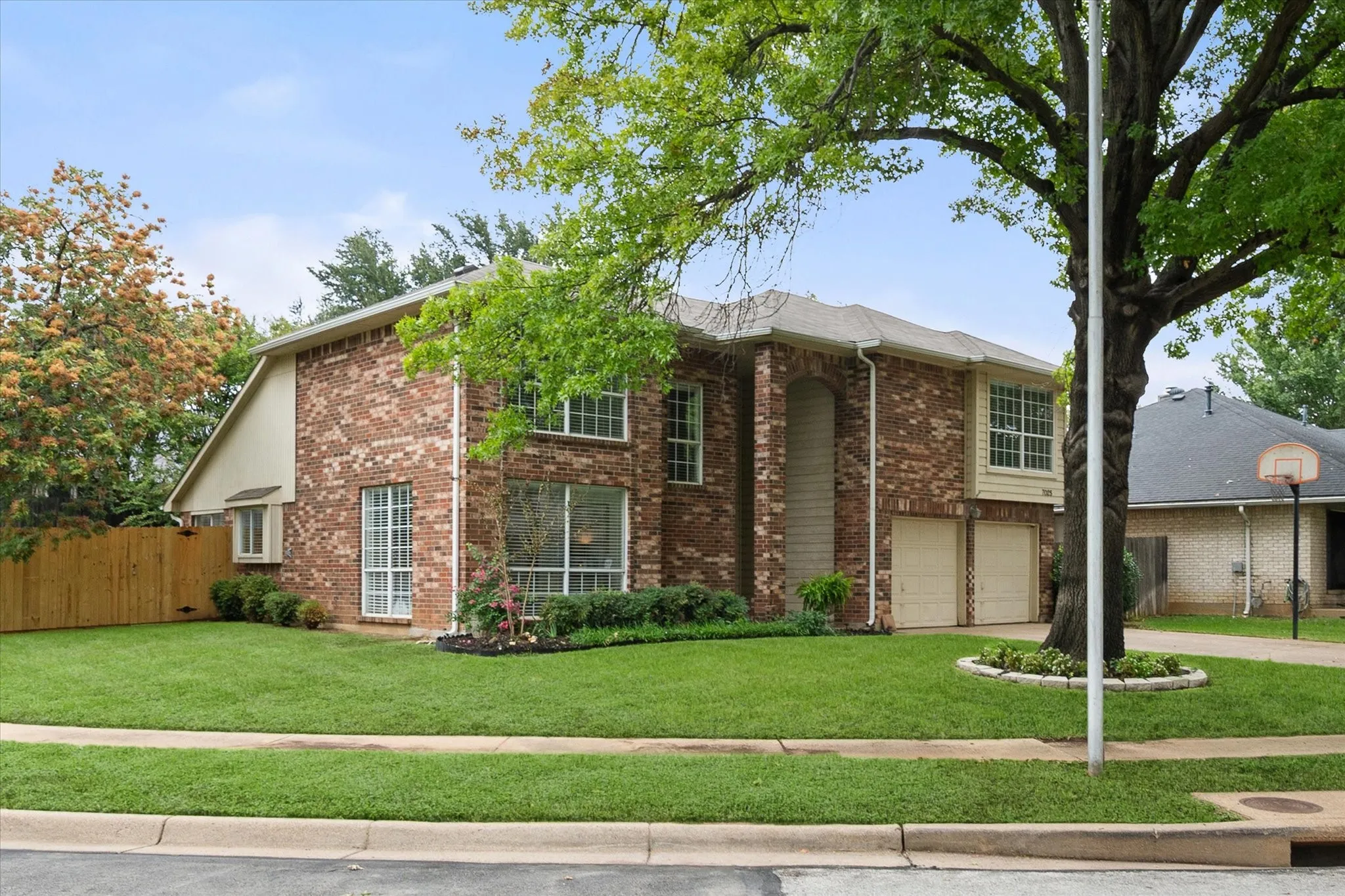 This large corner lot with sidewalks is a great place for play.
