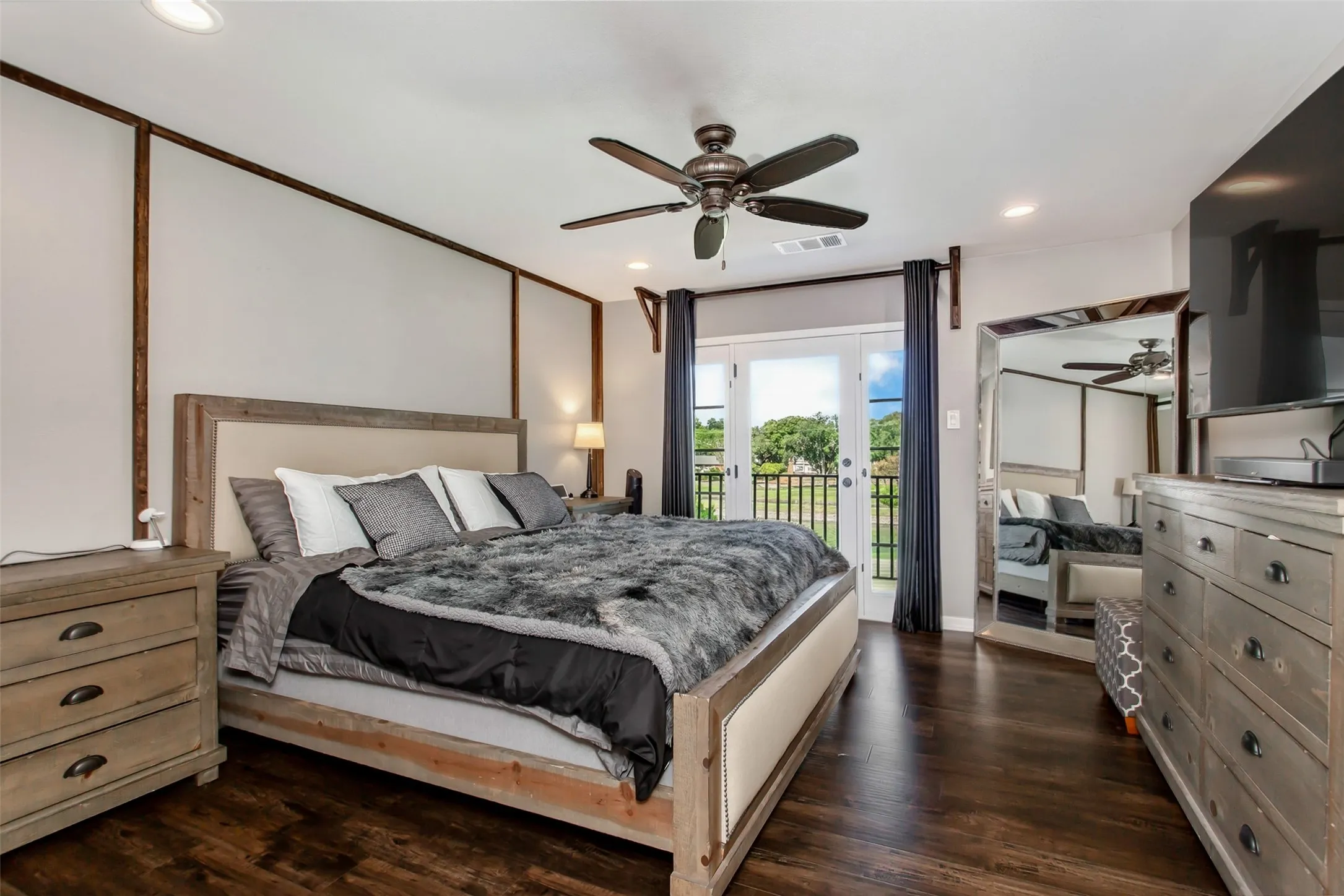 Dark wood-finish flooring with recessed lighting