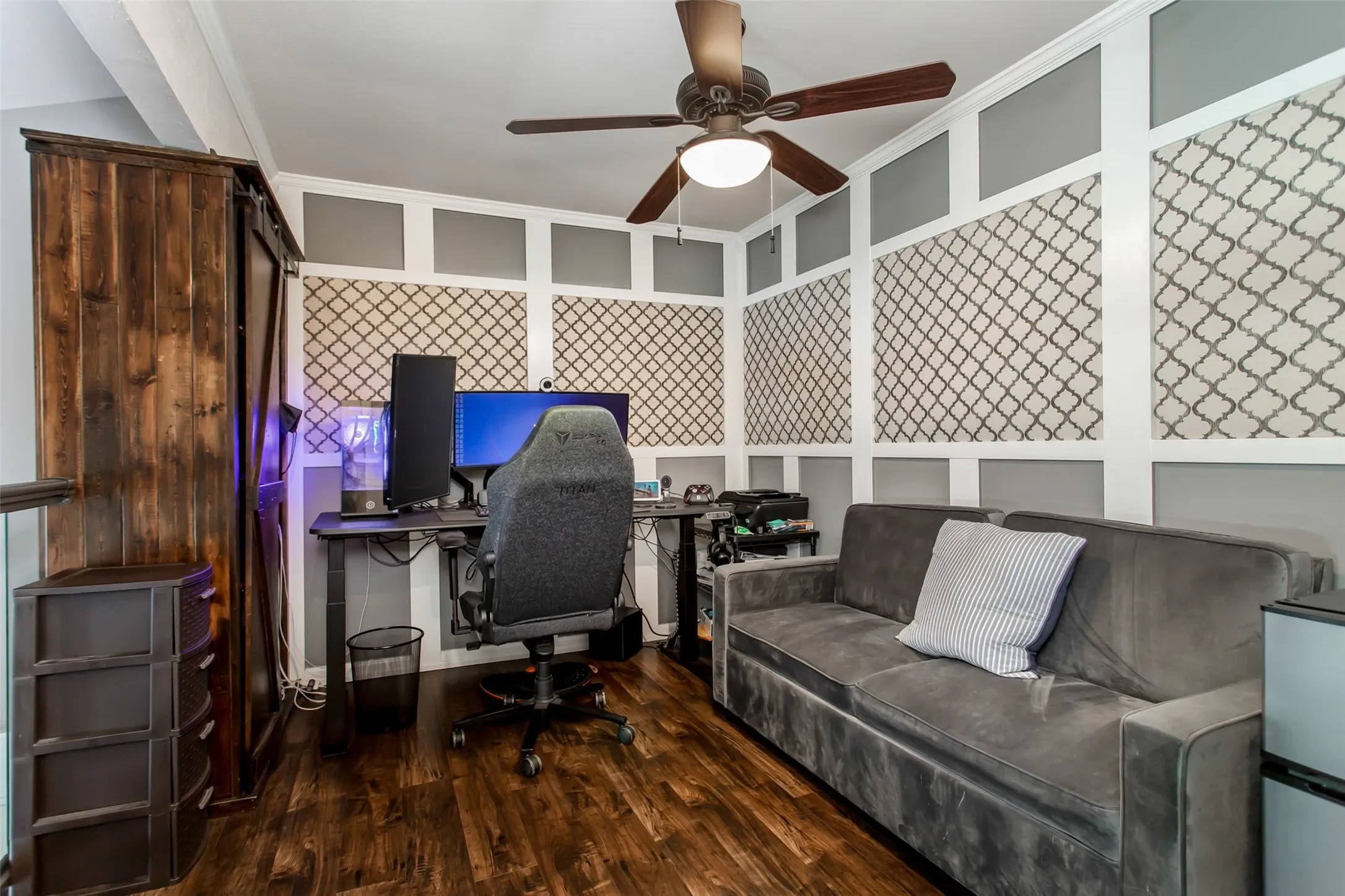 Wood-finish flooring with a ceiling fan light fixture