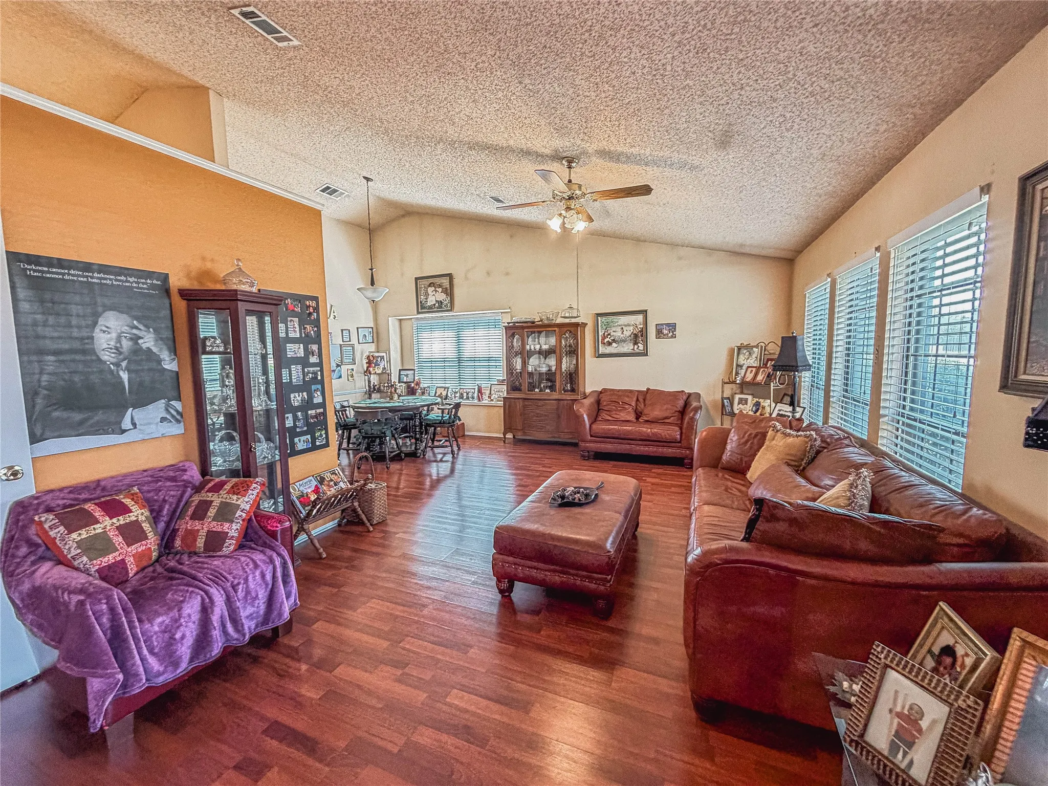 Vaulted ceiling featuring a ceiling fan with integrated lighting