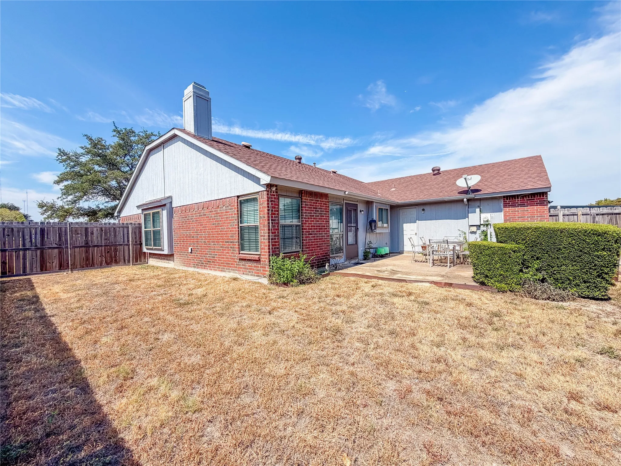 Brick and siding exterior with a pitched roof