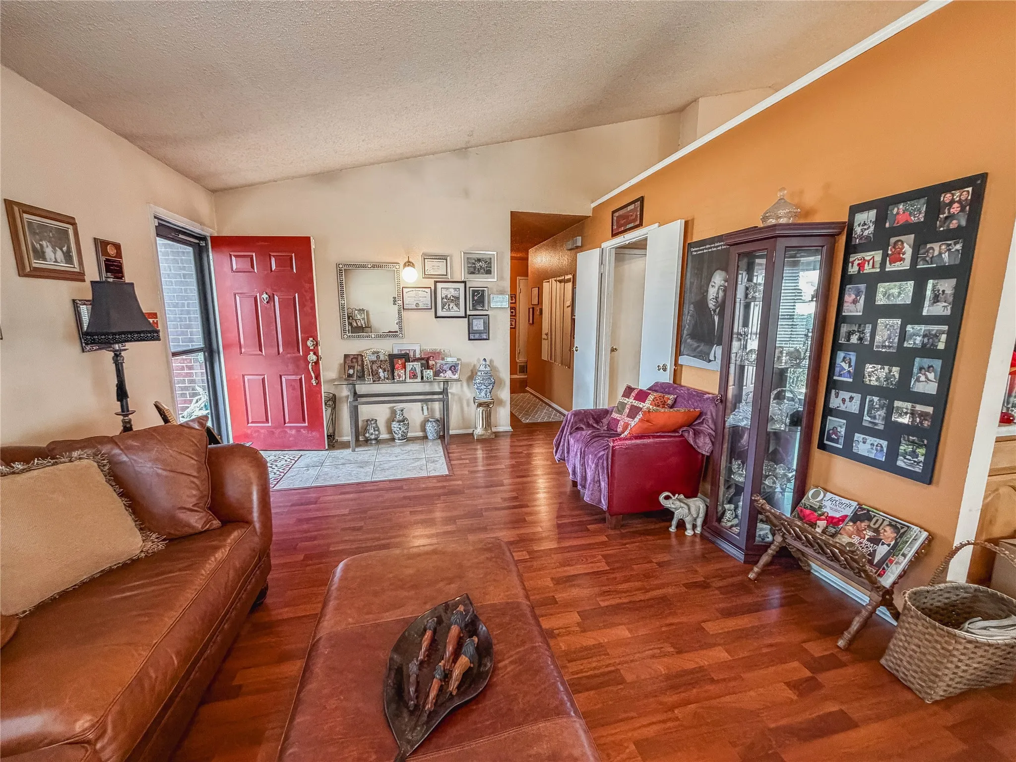 Wood-finish flooring throughout, complemented by a vaulted ceiling
