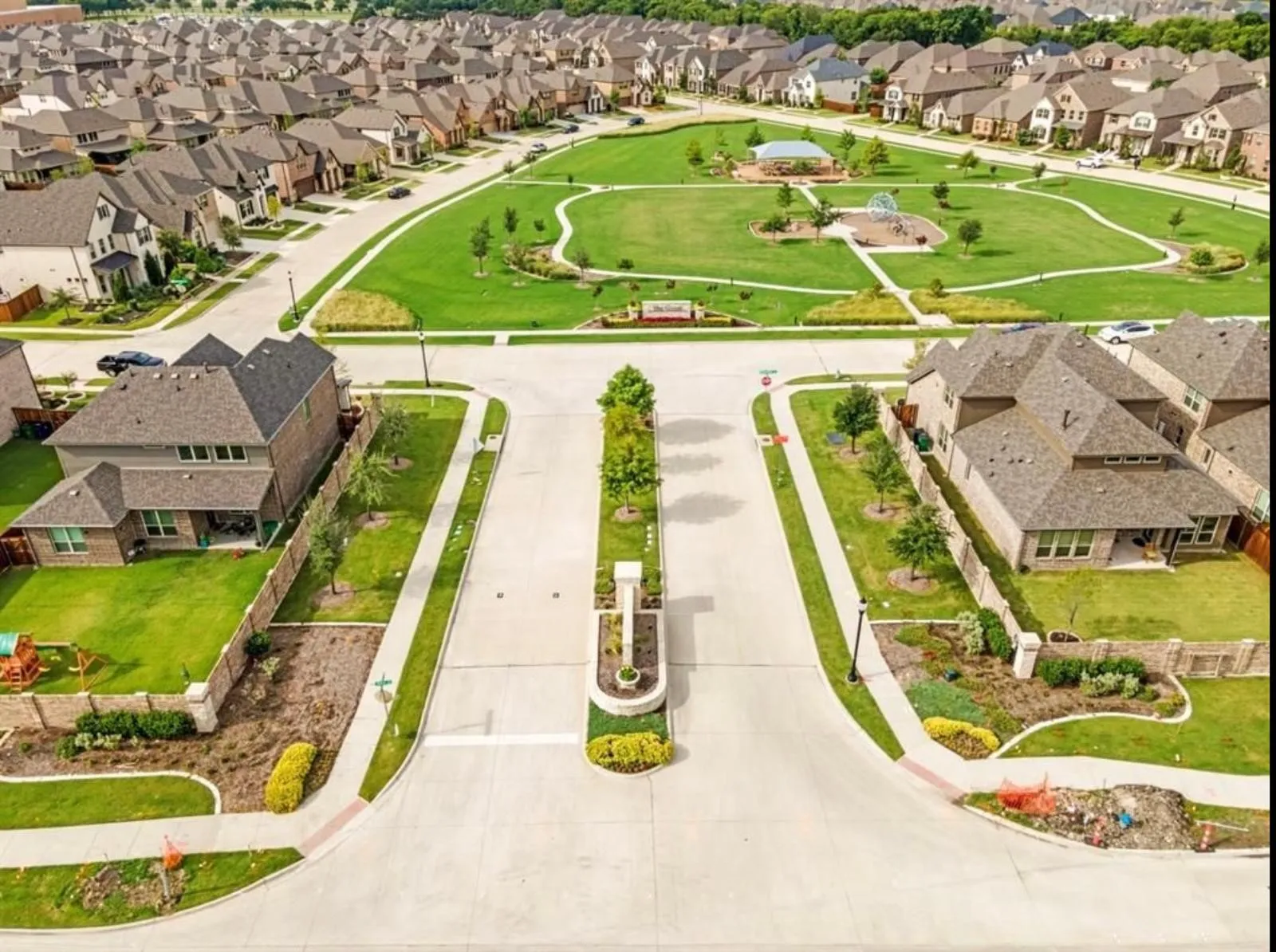Aerial perspective showcasing a residential community with uniform architectural styles