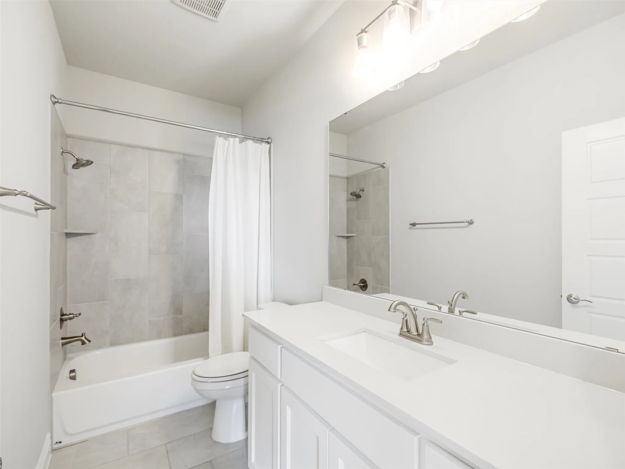 Full Secondary bathroom upstairs with tub shower combination.