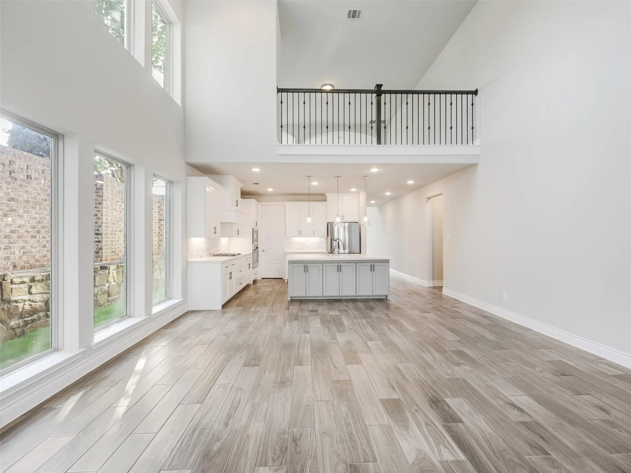 . The open-concept design allows the kitchen, dining, and living spaces to flow naturally together while still maintaining their individual character.