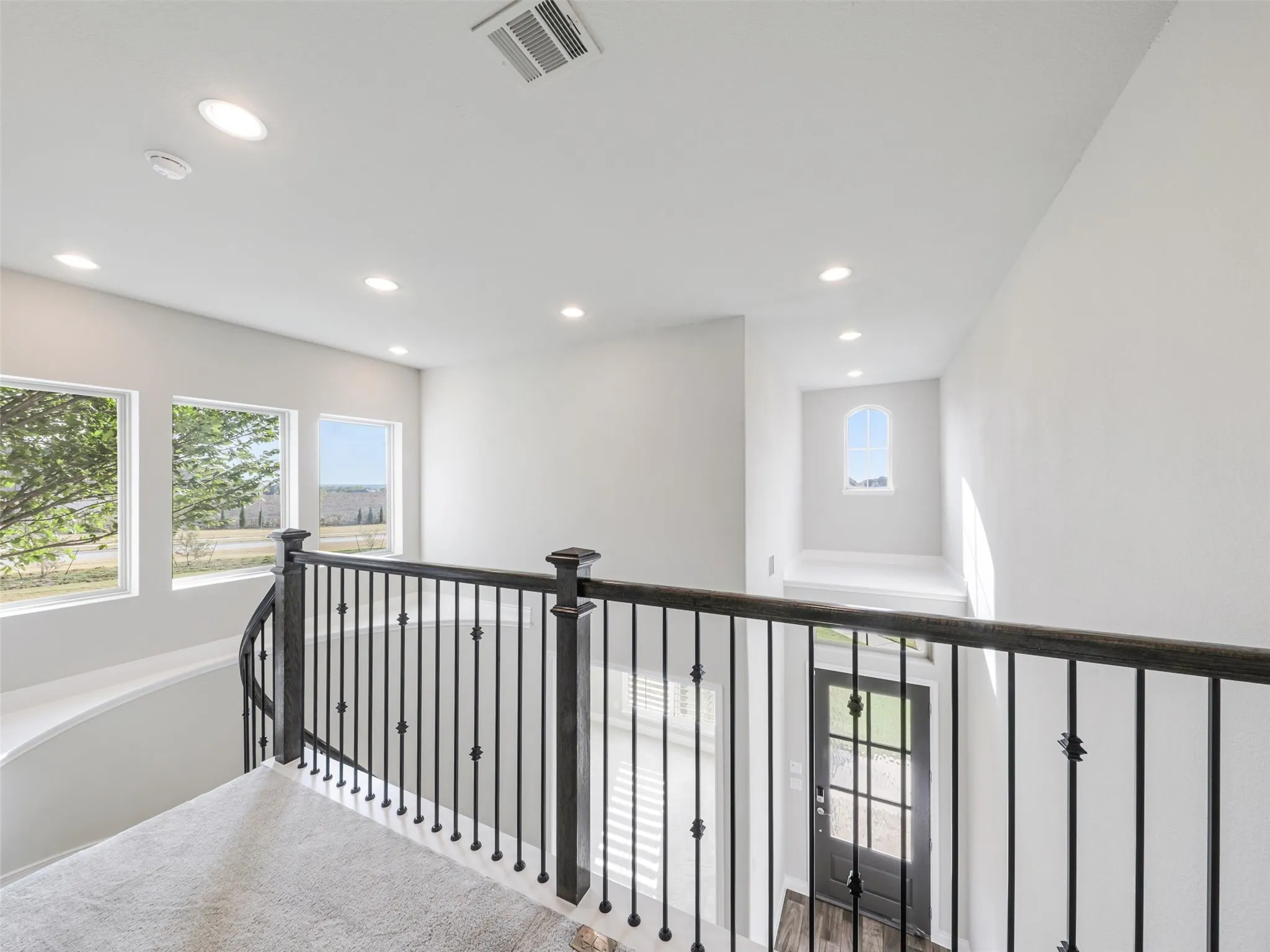 Upstairs, the home continues to offer generous living and storage space