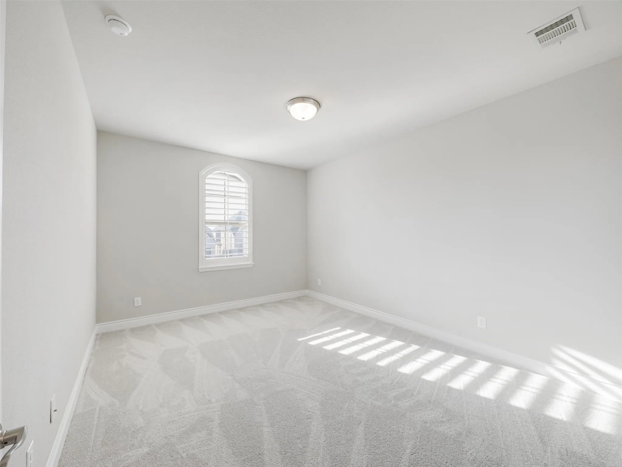Two additional secondary bedrooms are also located upstairs, each featuring a walk-in closet for excellent storage.