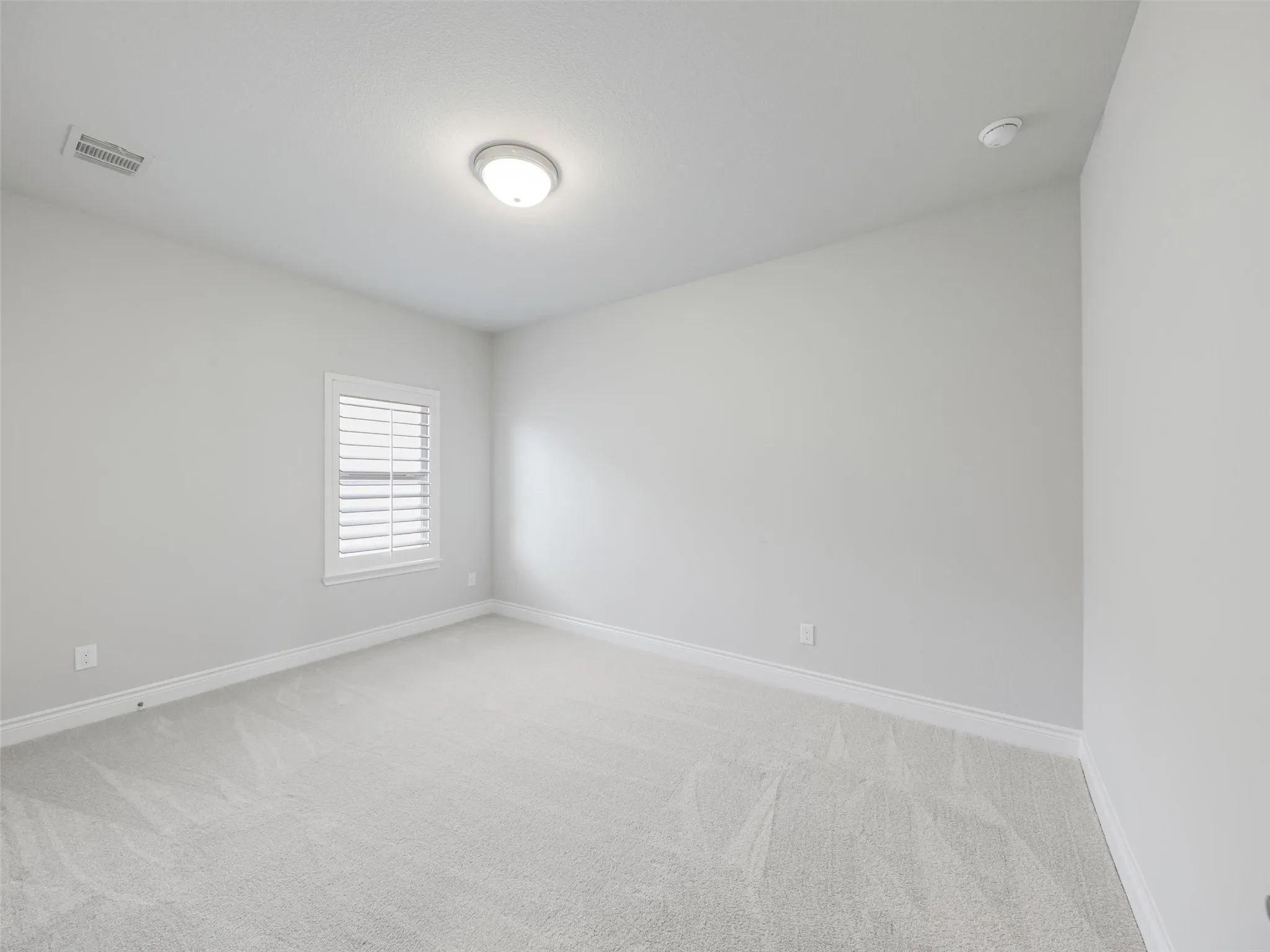 Two additional secondary bedrooms are also located upstairs, each featuring a walk-in closet for excellent storage.