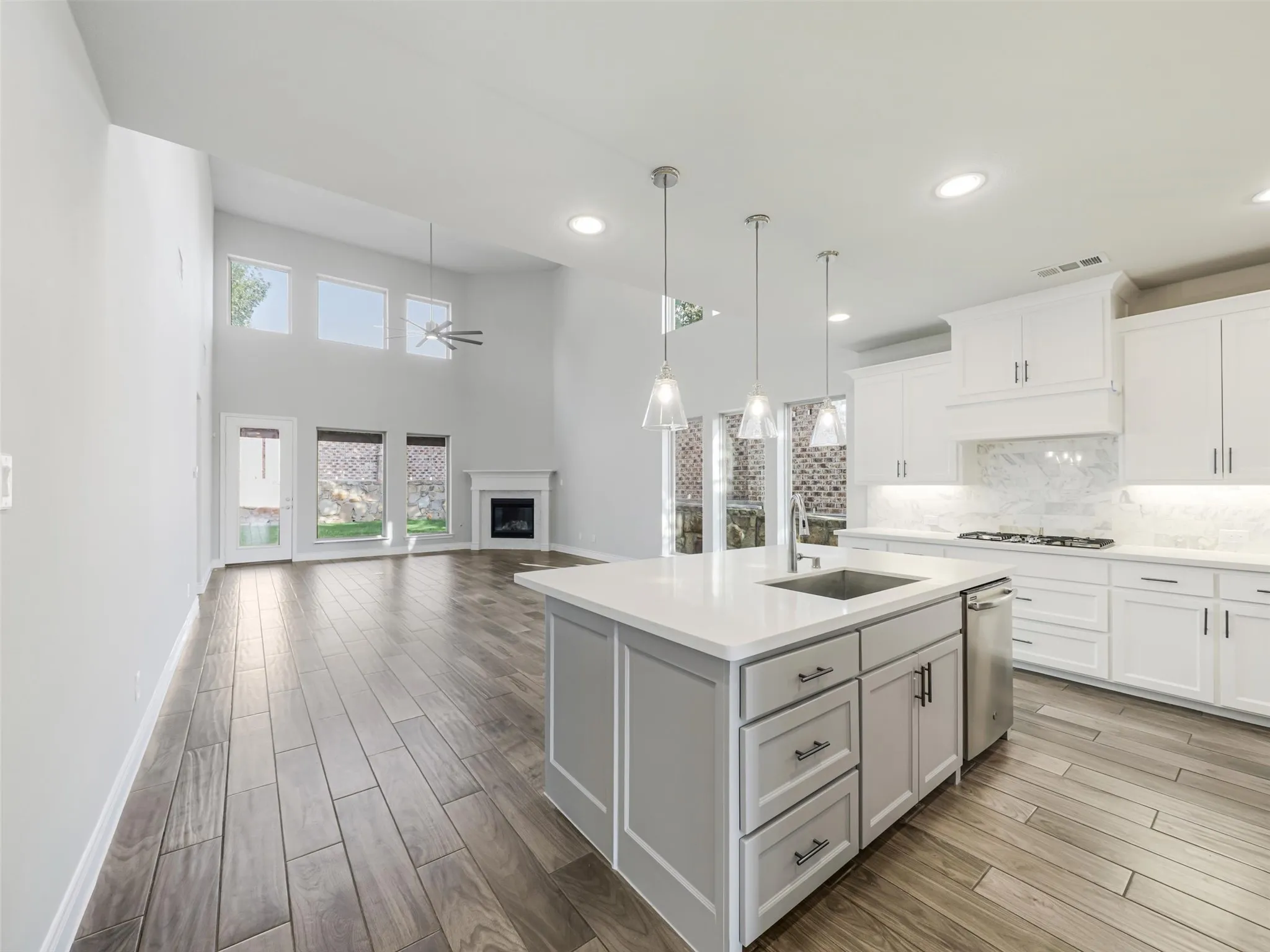 . The open-concept design allows the kitchen, dining, and living spaces to flow naturally together while still maintaining their individual character.