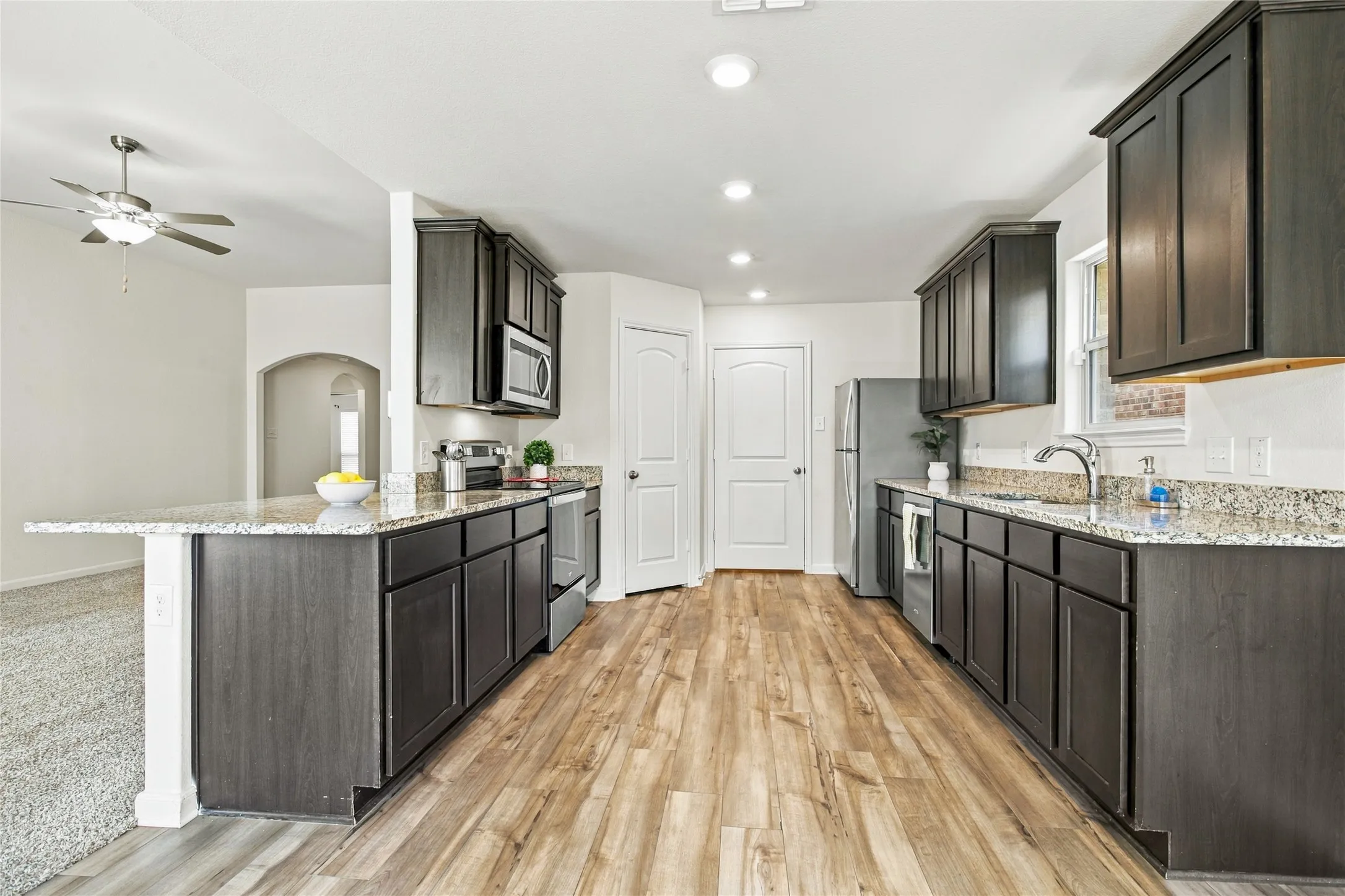 View of the Kitchen with Granite Countertops and matching Whirlpool Appliances