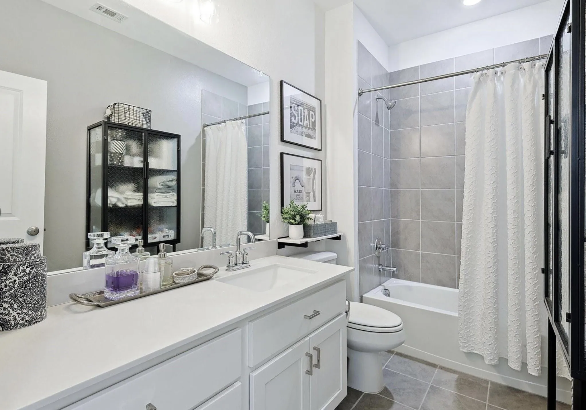 White vanity with an integrated sink and chrome fixtures