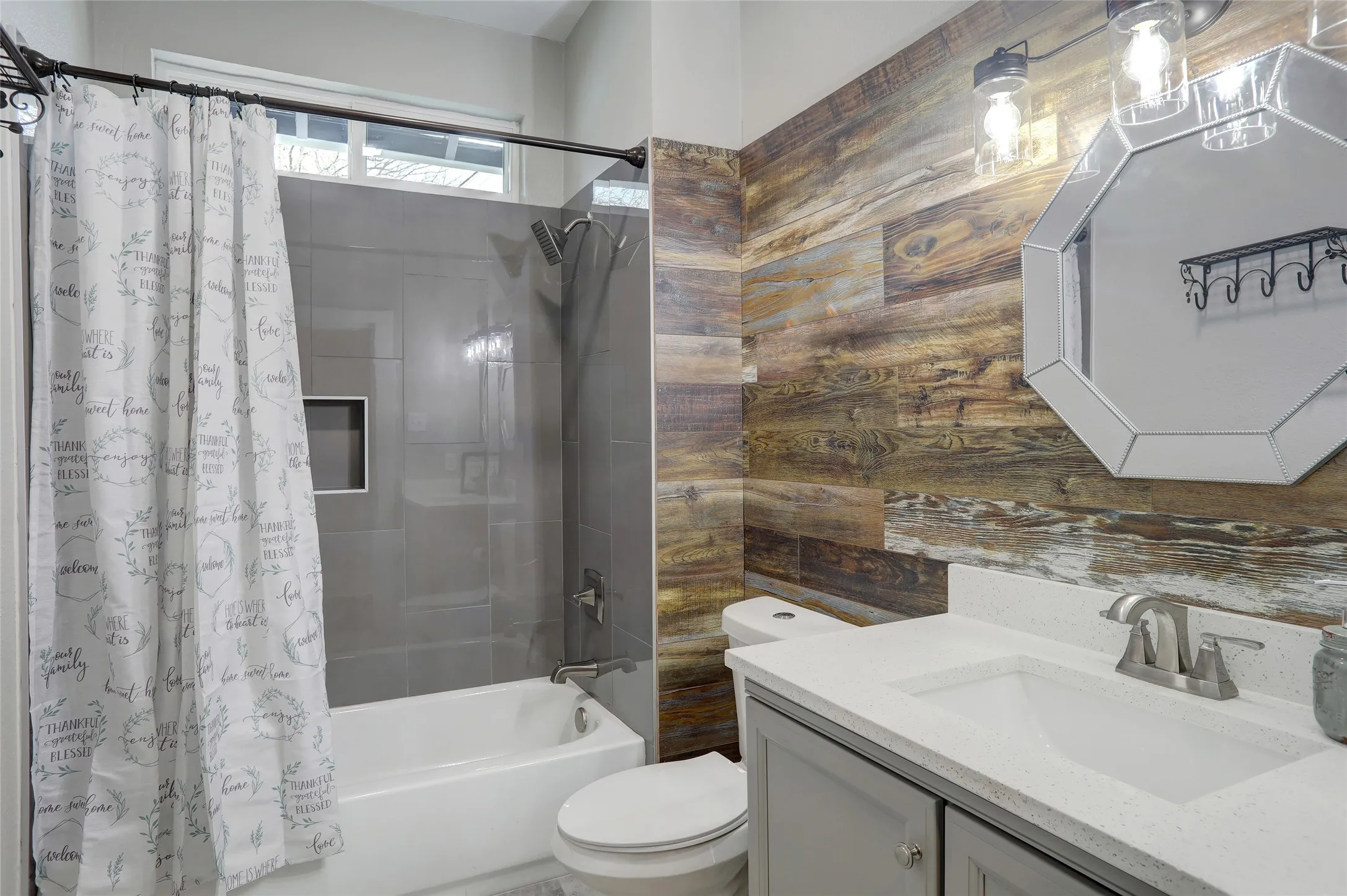 Vanity with built-in sink, light gray cabinetry, and a light-toned countertop