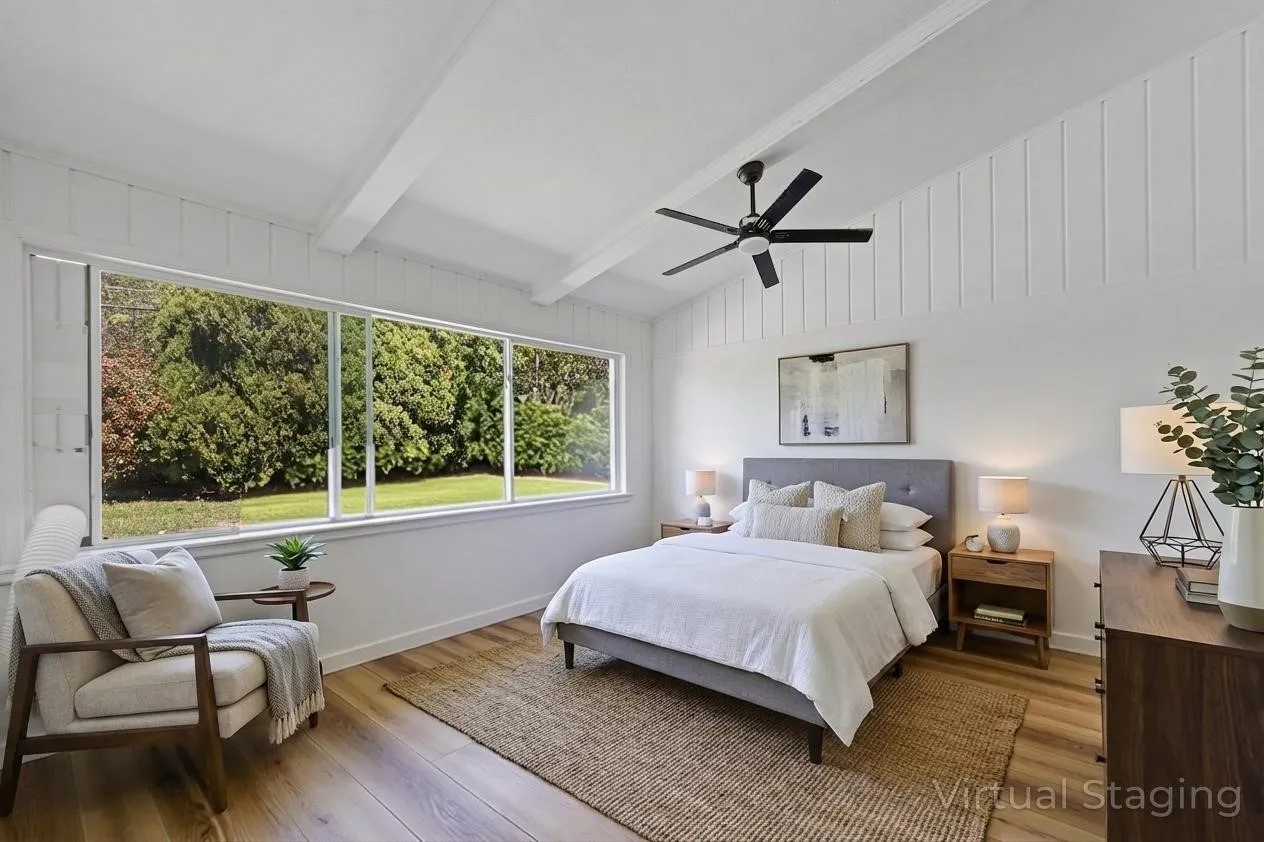 Vaulted ceiling with exposed beams, wood-finish flooring, large picture windows, and a ceiling fan