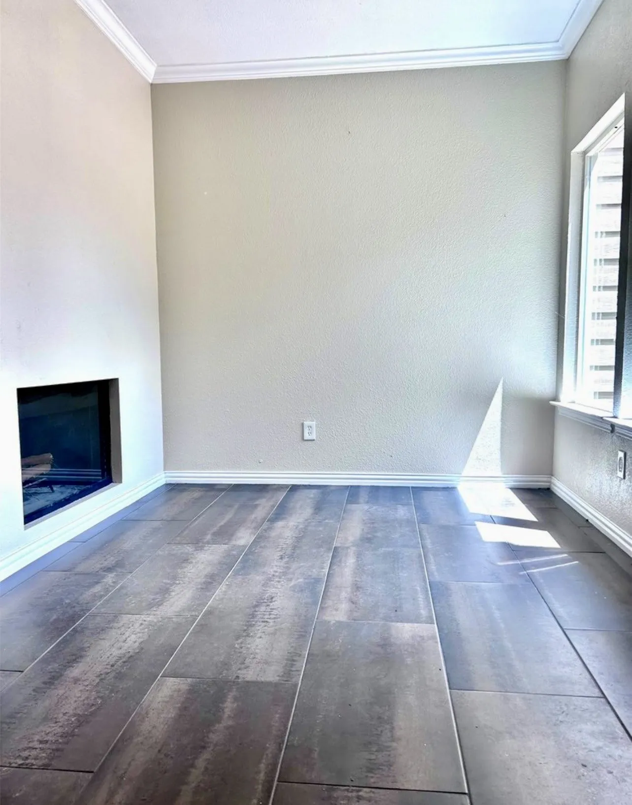 Enjoy this flexible space just inside the front door.  Highlighted by a double-sided fireplace and updated flooring.  This space would make a great study or play space.