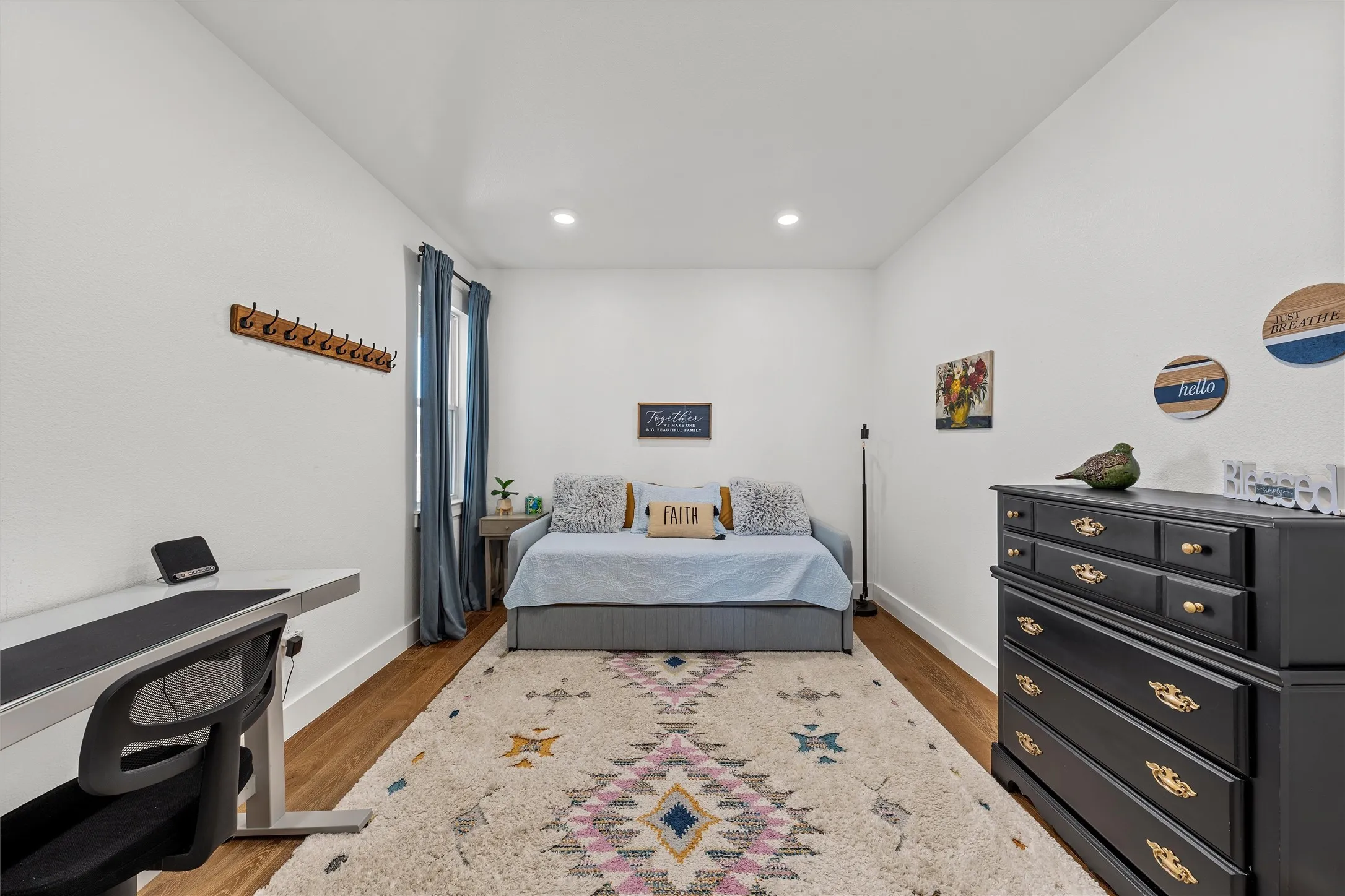 Recessed lighting, wood-finish flooring, white walls, and a window with curtains (Office)