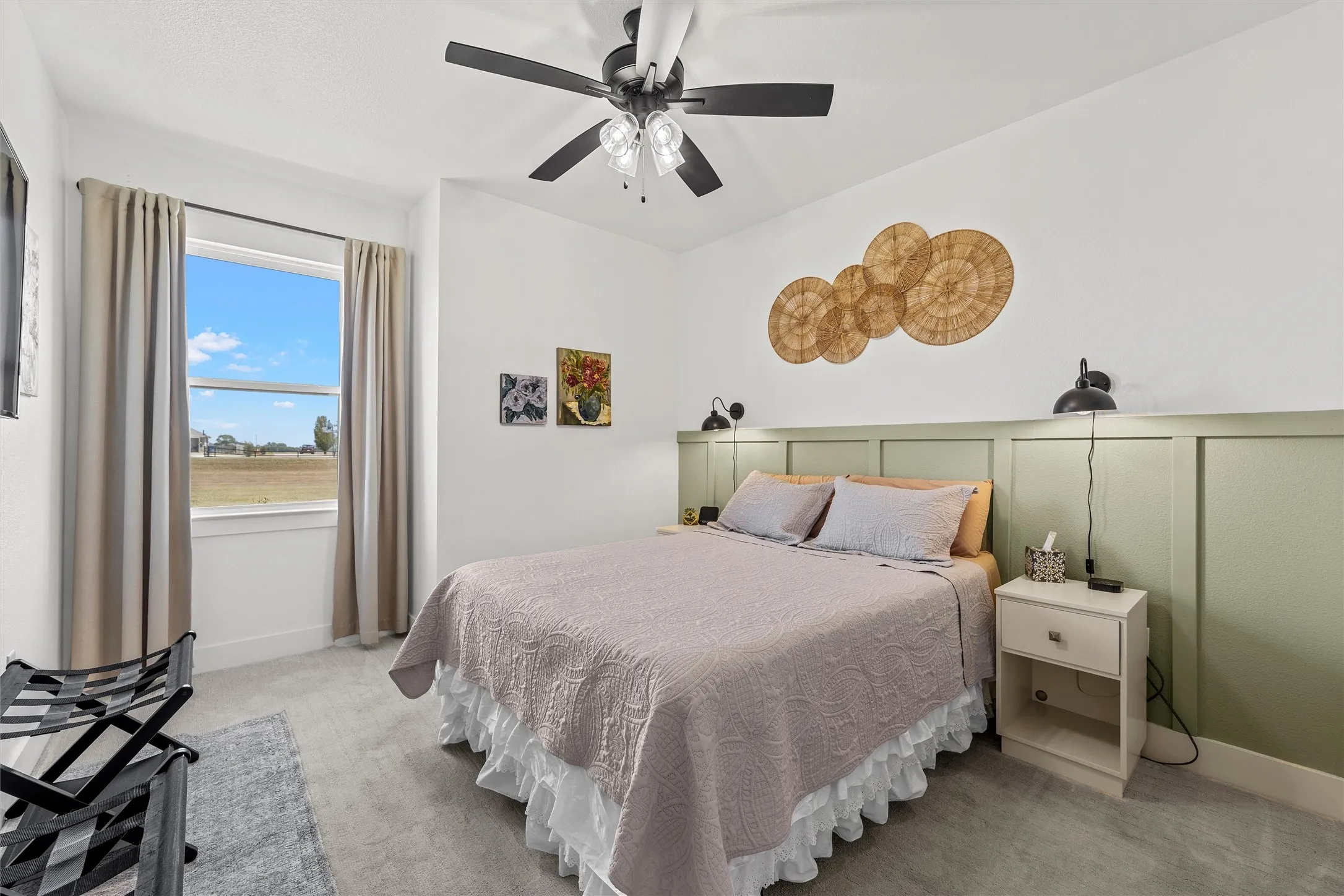 Recessed window with a spacious sill, board and batten accent wall, ceiling fan with integrated lighting, wall-mounted light fixtures, and plush carpet​​‌​​​​‌​​‌‌​‌‌​​​‌‌​‌​‌​‌​​​‌​​ flooring