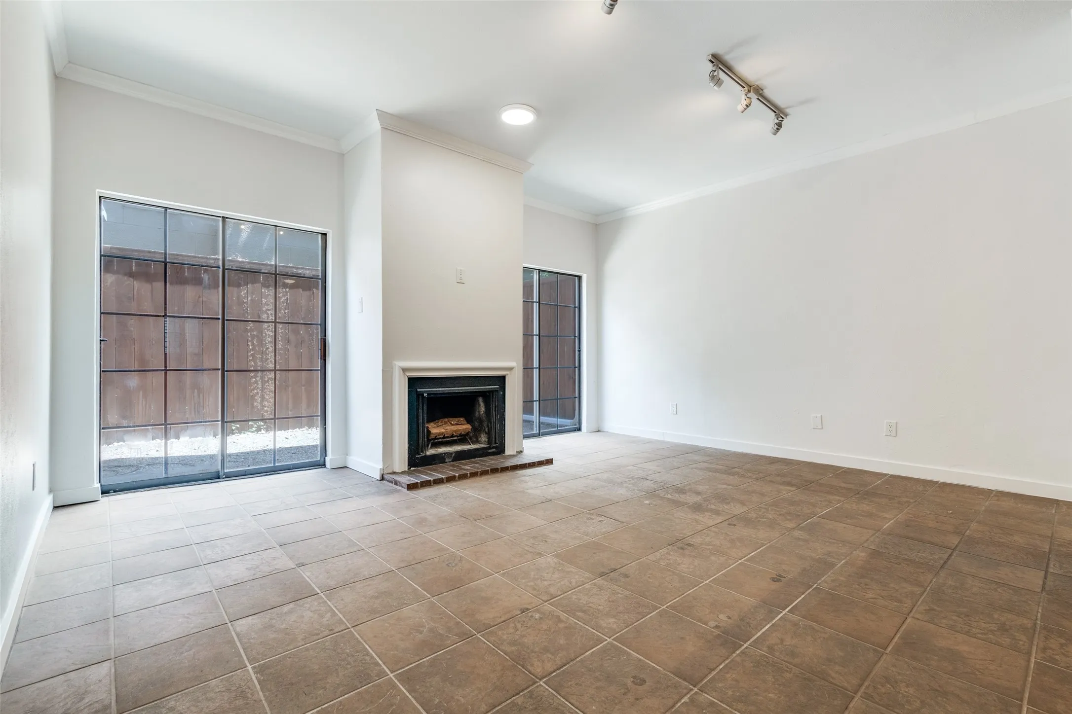 Large living room with wood burning fireplace