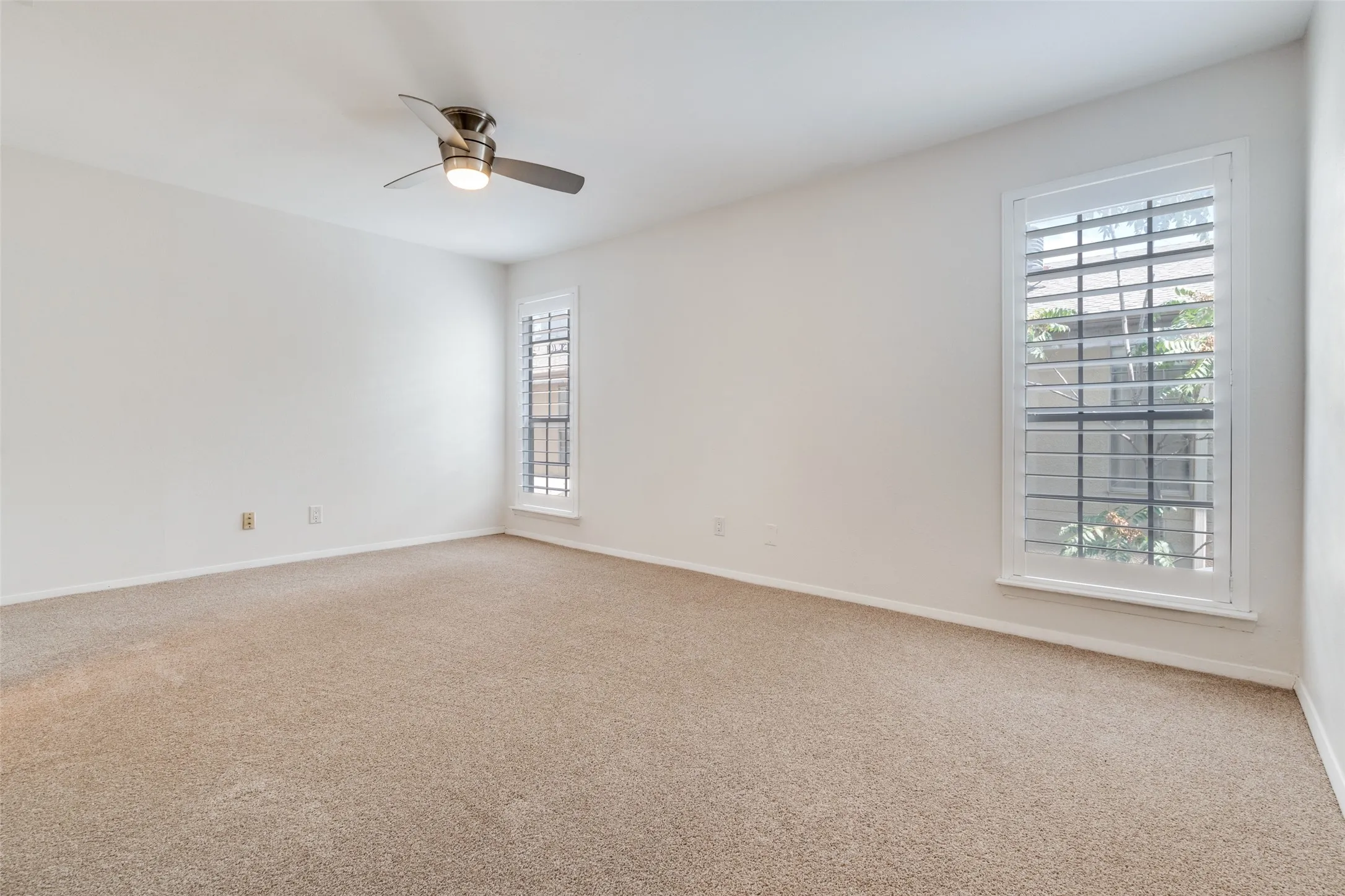 Primary master bedroom with NEW carpet & good closet storage.