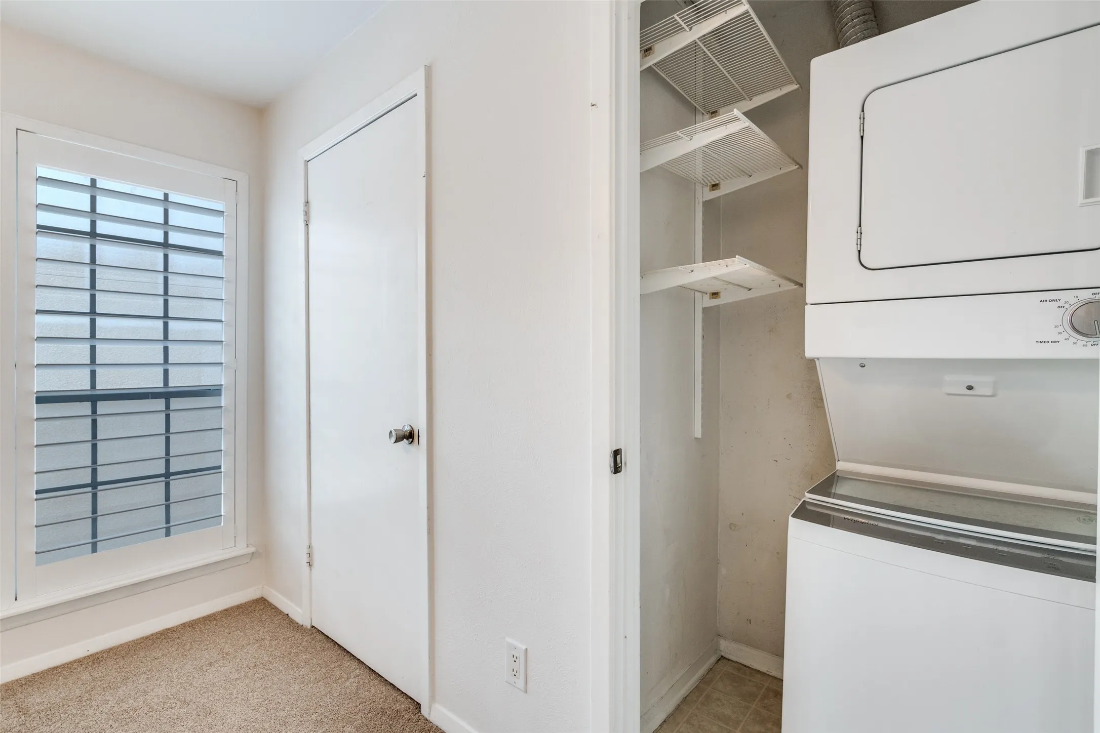 Two closets in guest room and one holds the washer & dryer.