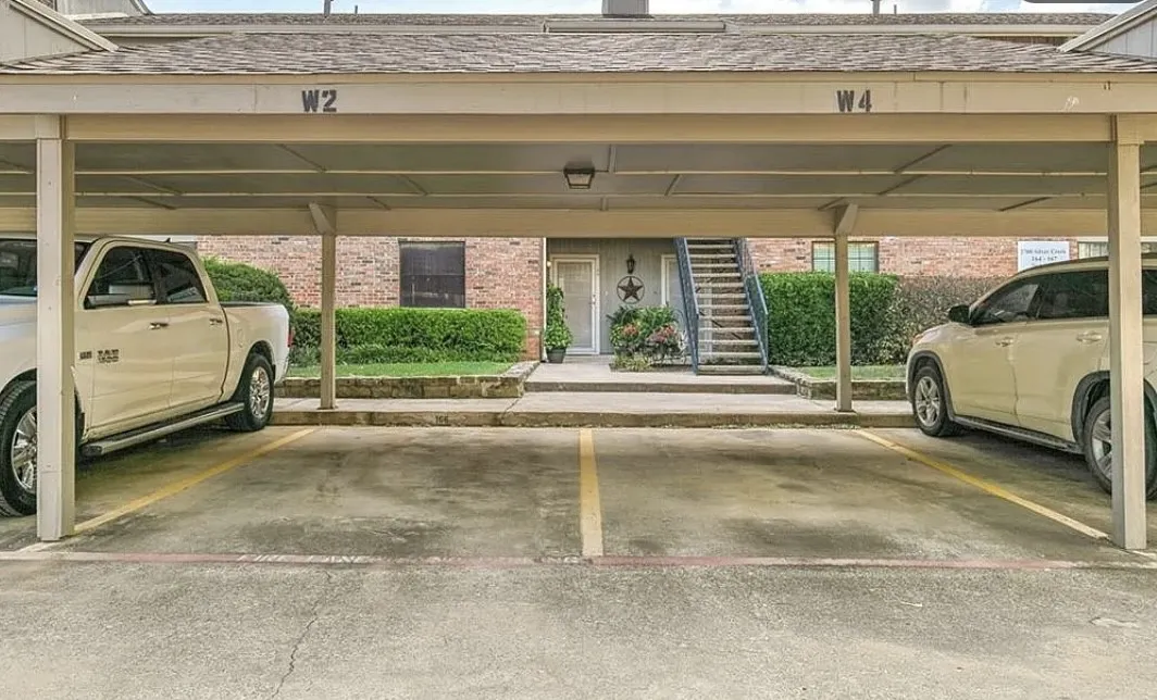 Covered parking structure with designated parking spaces