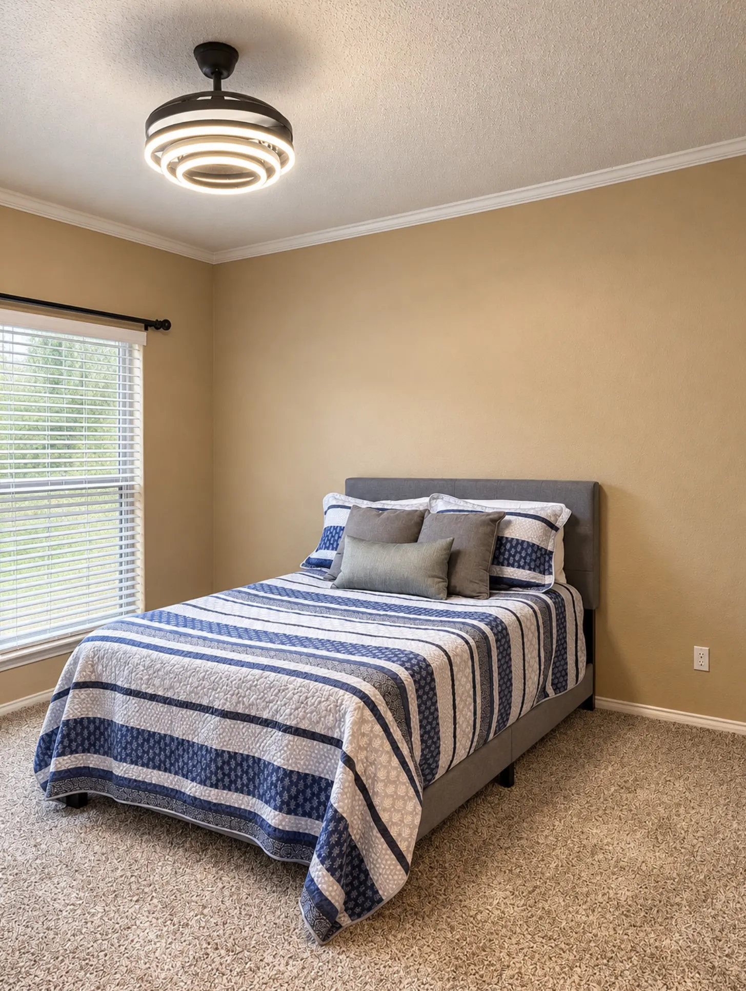 Recessed window with blinds, crown molding, modern ceiling light fixture, neutral wall color, and carpet flooring