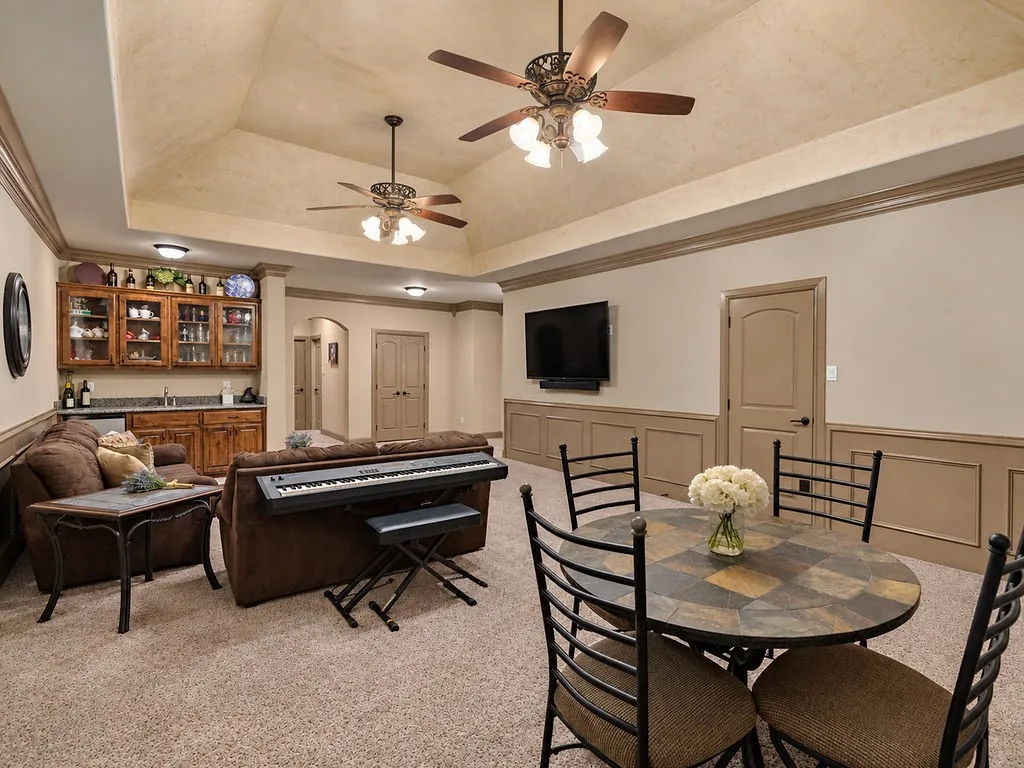 Upstairs gameroom with access to 2nd set of stairs leading down to kitchen.