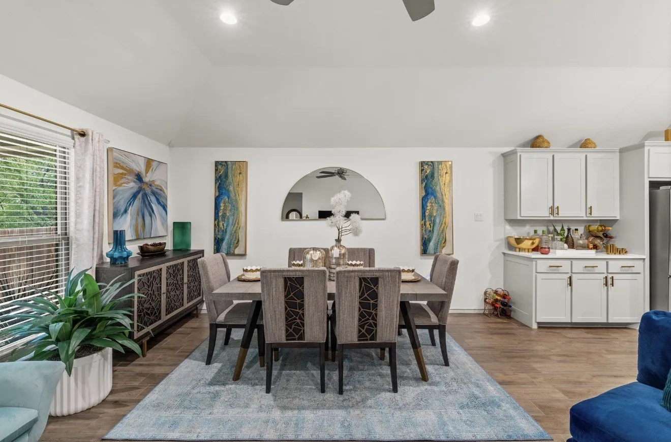 Vaulted ceiling with recessed lighting and a ceiling fan