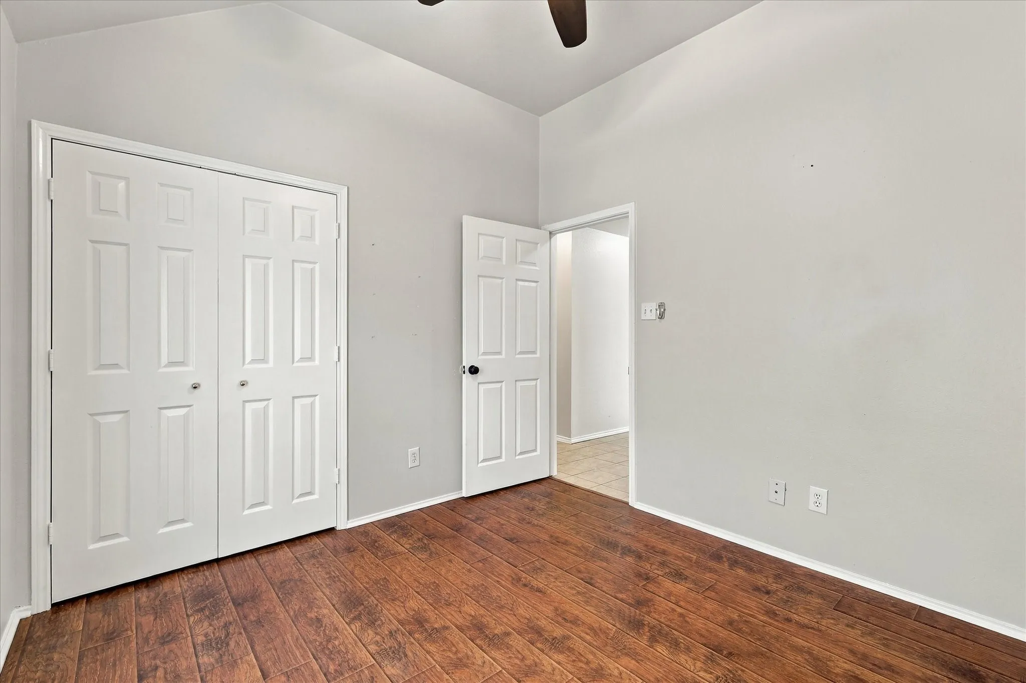 Middle Bedroom featuring vaulted ceiling and ceiling fan