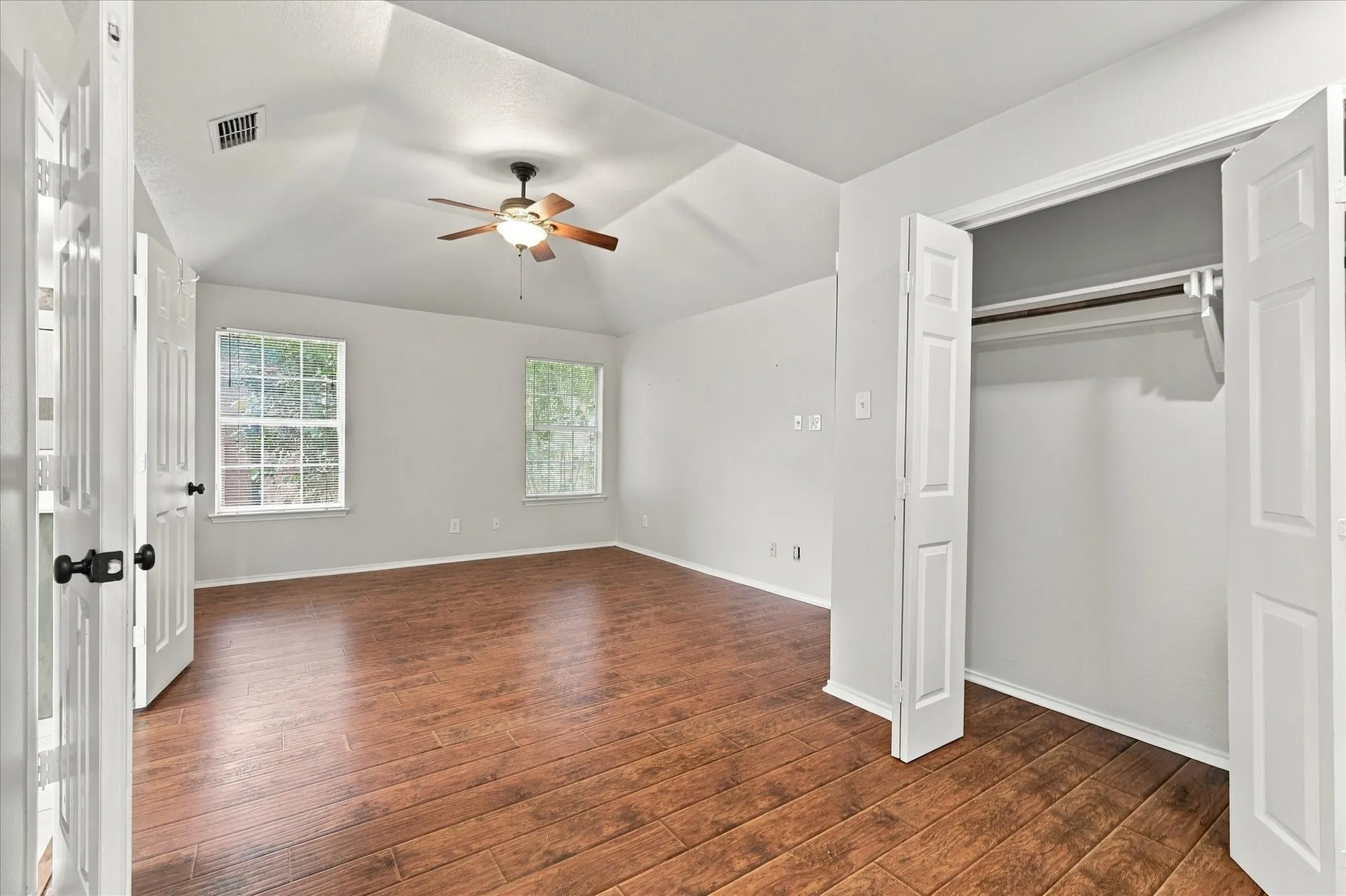 The spacious primary suite includes a sitting area and THREE closets, while the primary bath offers separate vanities, a garden tub and separate shower.
