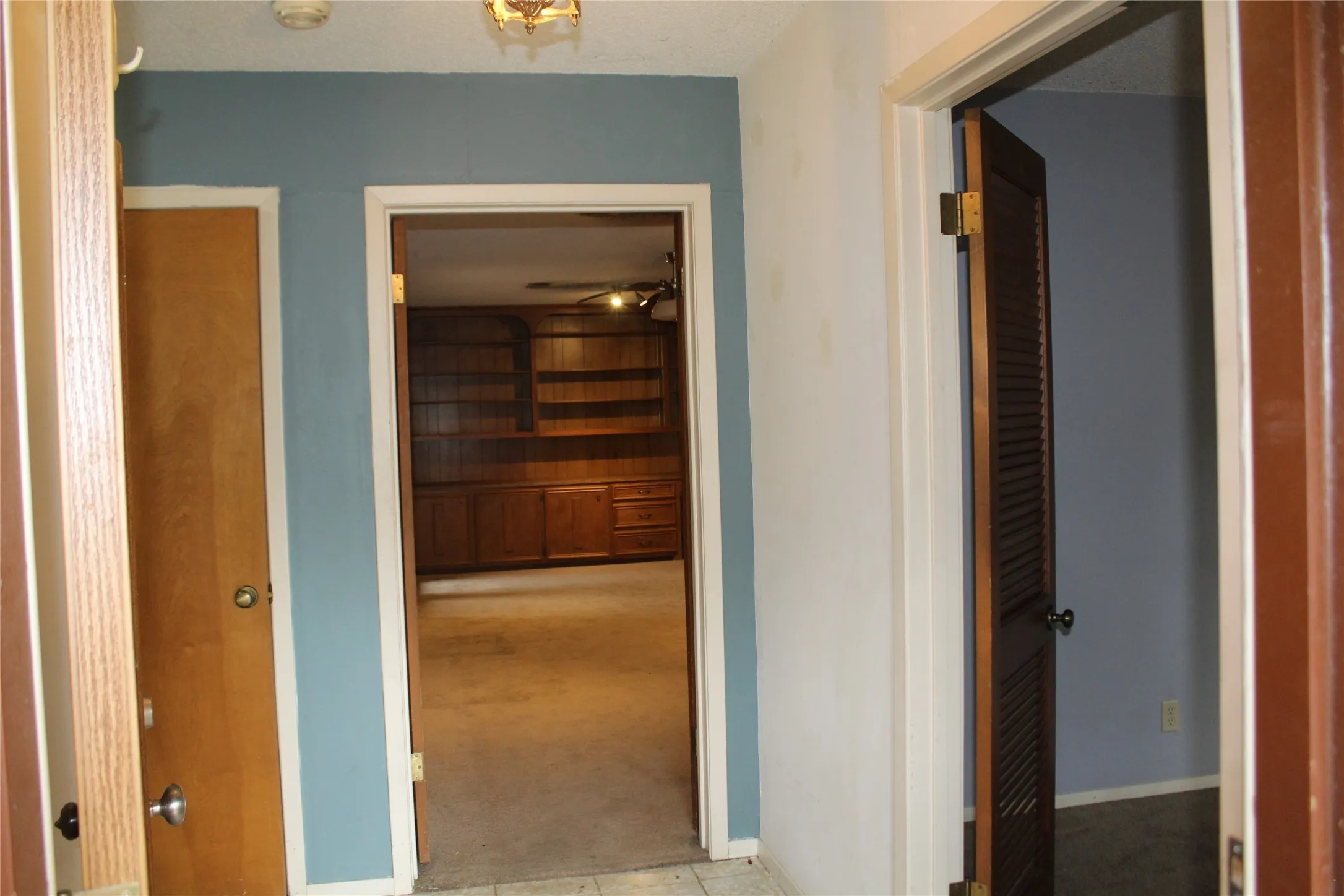 Built-in wood cabinetry with shelving and drawers
