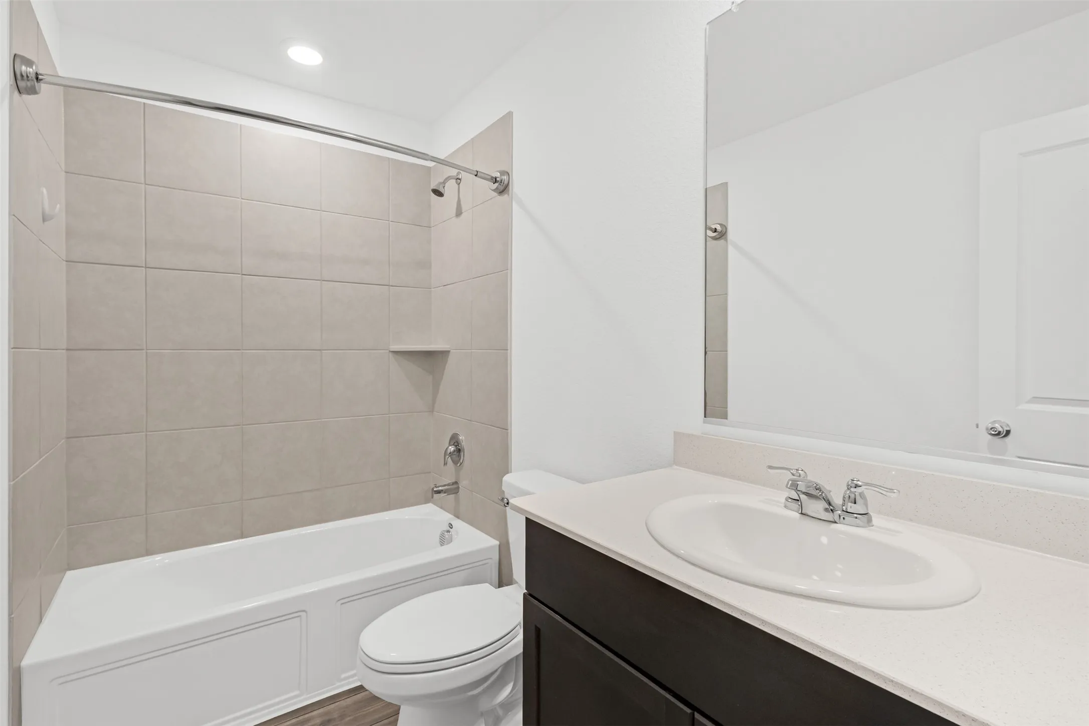 Tub and shower combination with light-toned wall tile