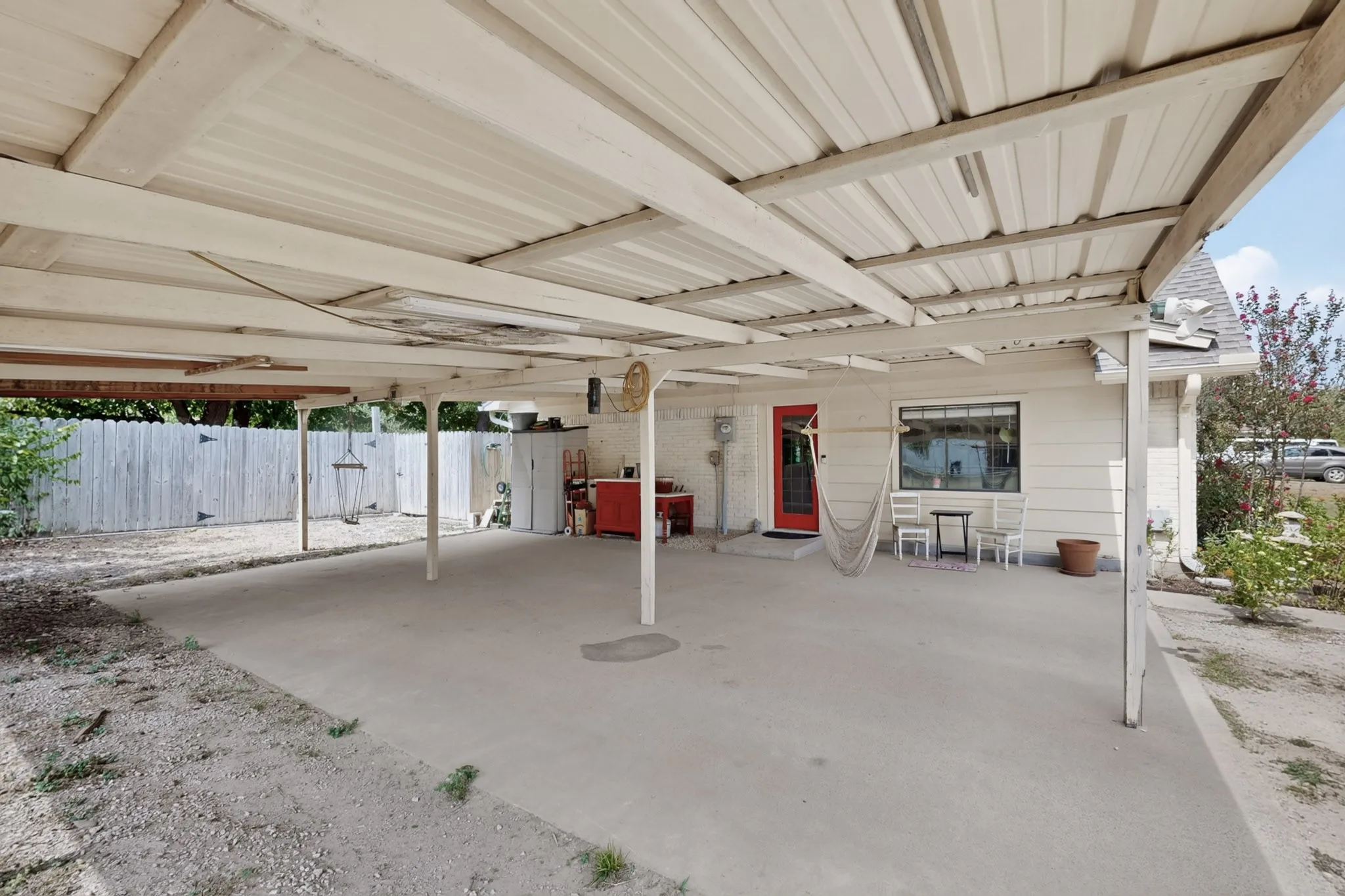 Carport located to the left side of the home offers two parking space and room to enjoy outdoor entertaining.
