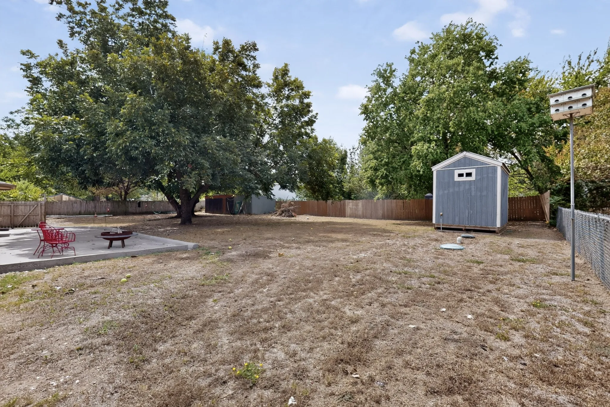 Fully fenced backyard also holds 2 storage structures - ideal for hobbyists and additional storage.