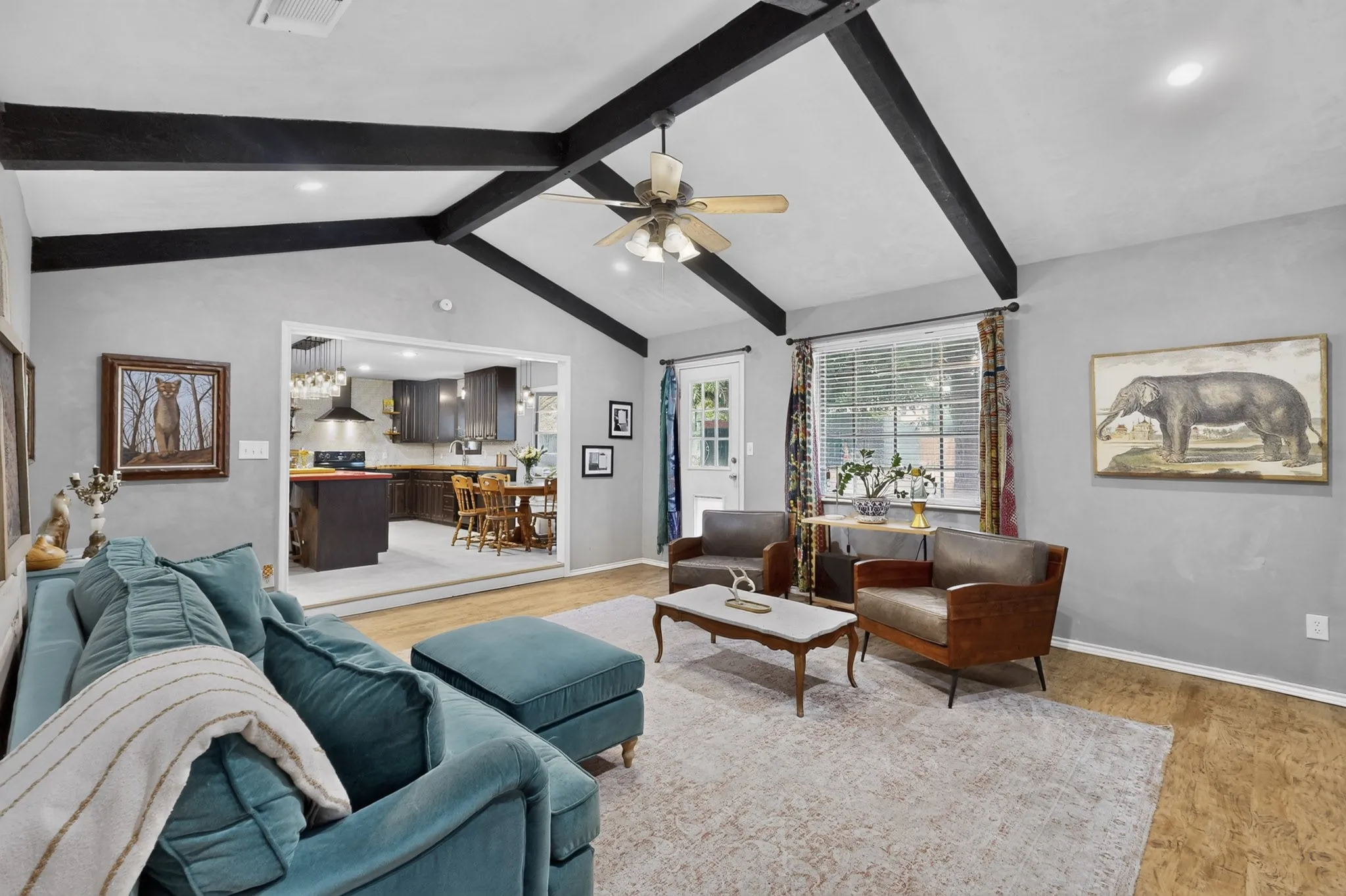 This living room flows into the open concept kitchen and dining area, perfect for entertaining.