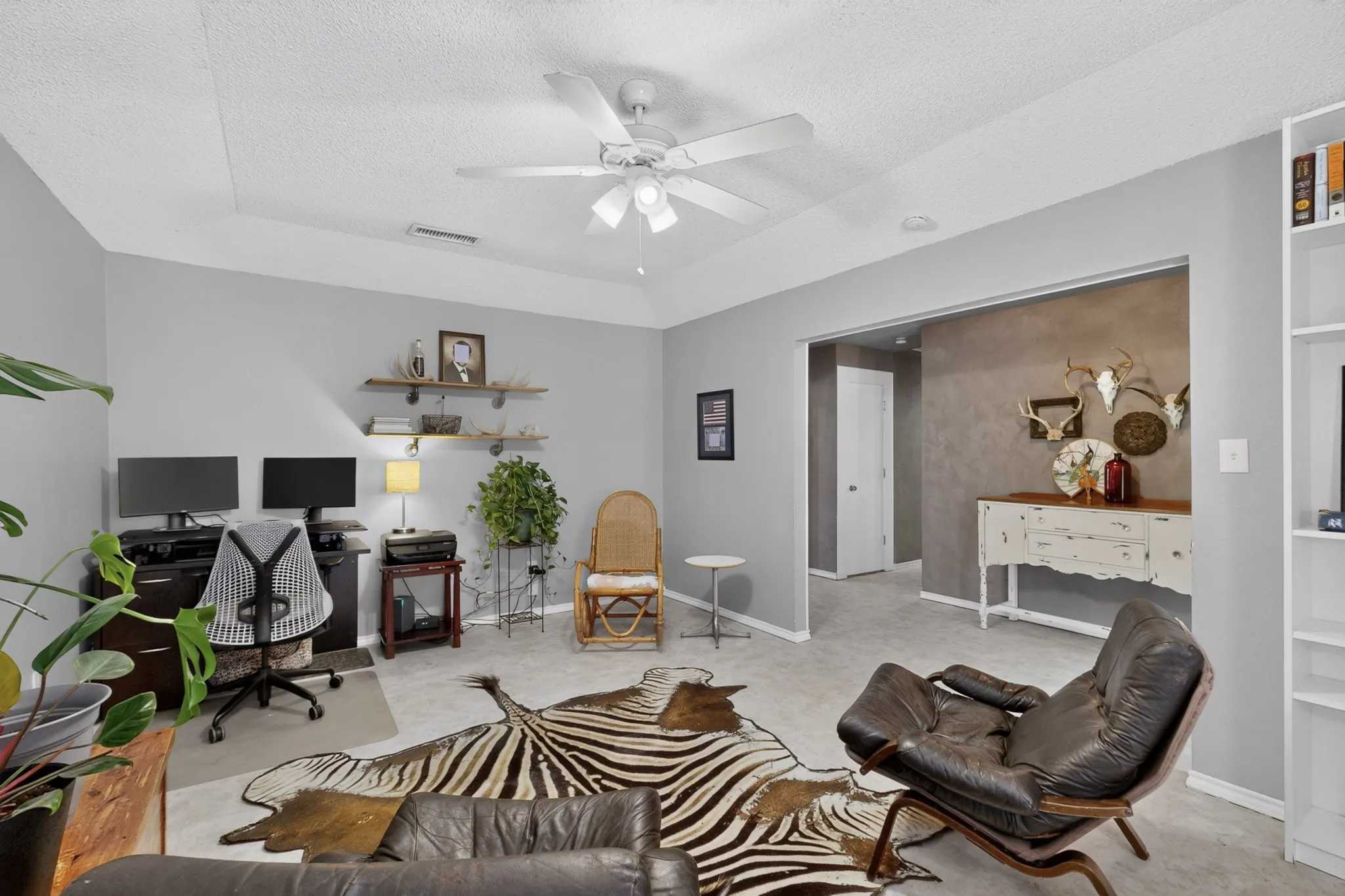 Upon entering the home, the office/secondary living space is directly to the left.